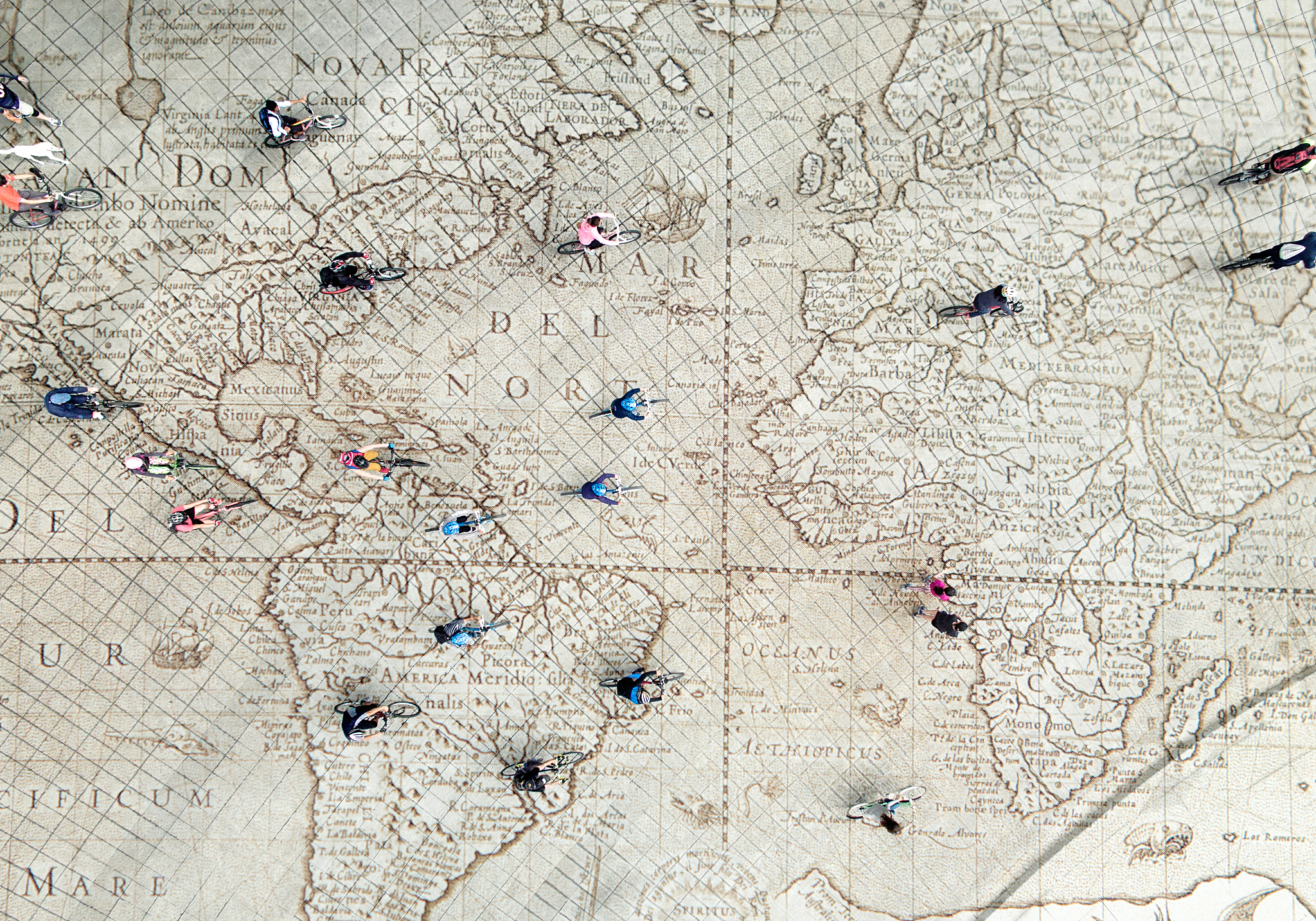 crowd riding bikes on global map