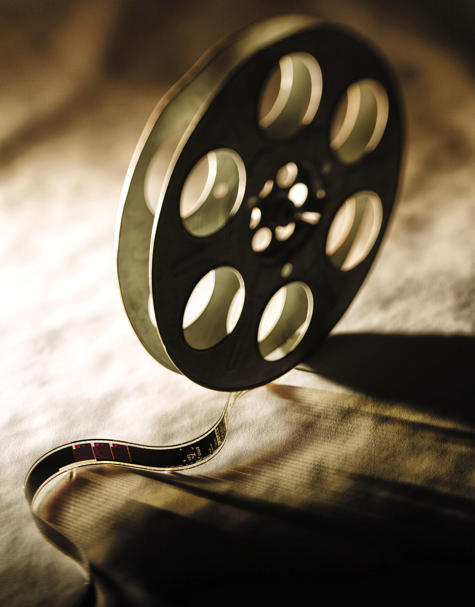 35mm movie film with metal reels.