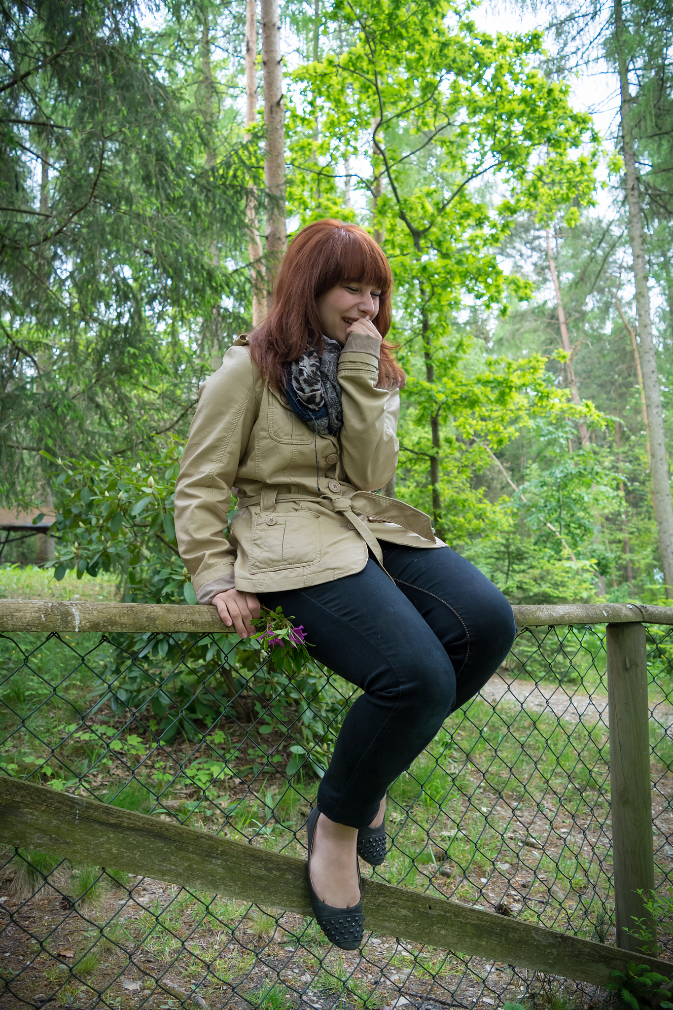 woman smiling on a fence ii