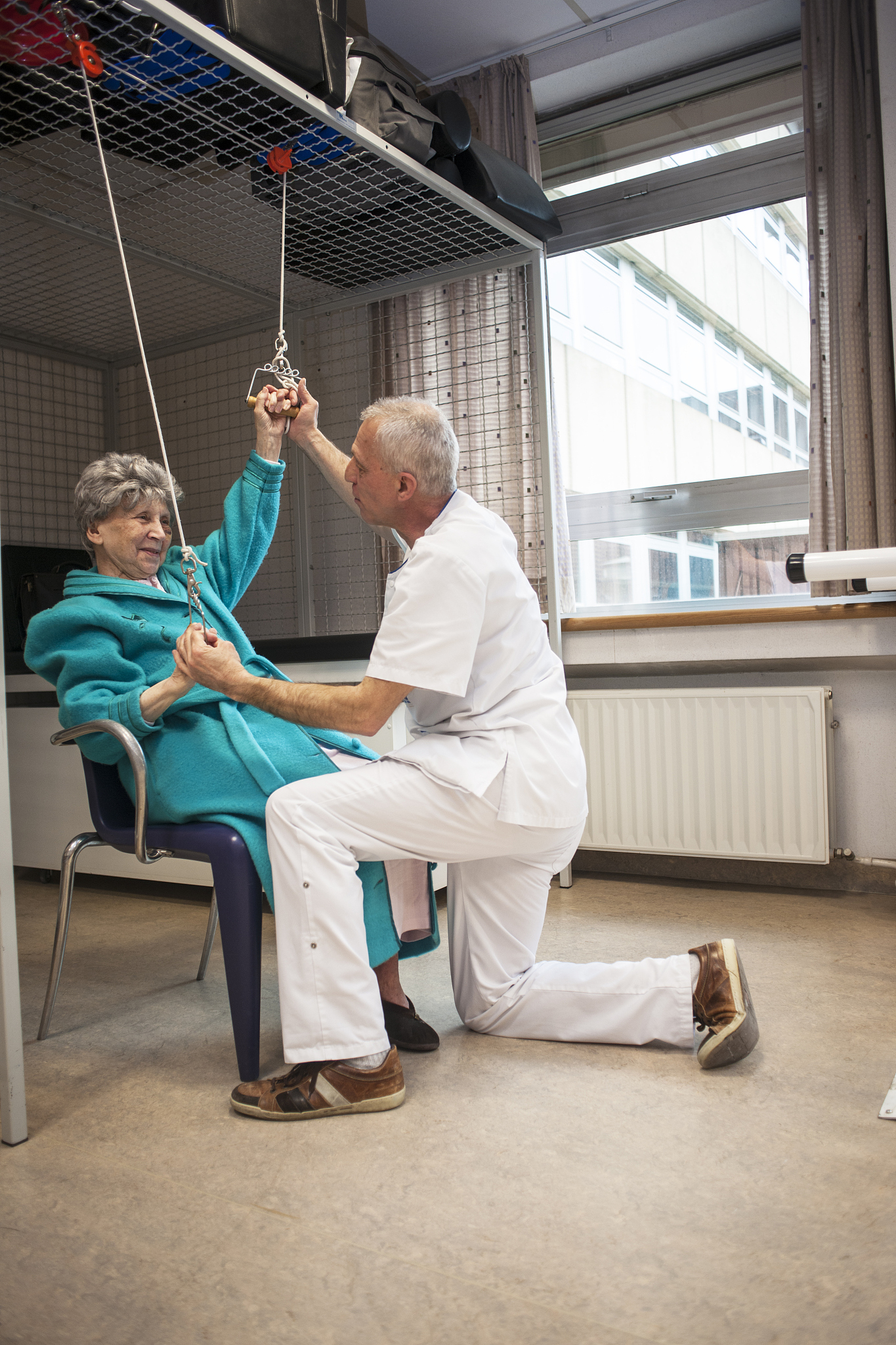 physical therapist working with patient
