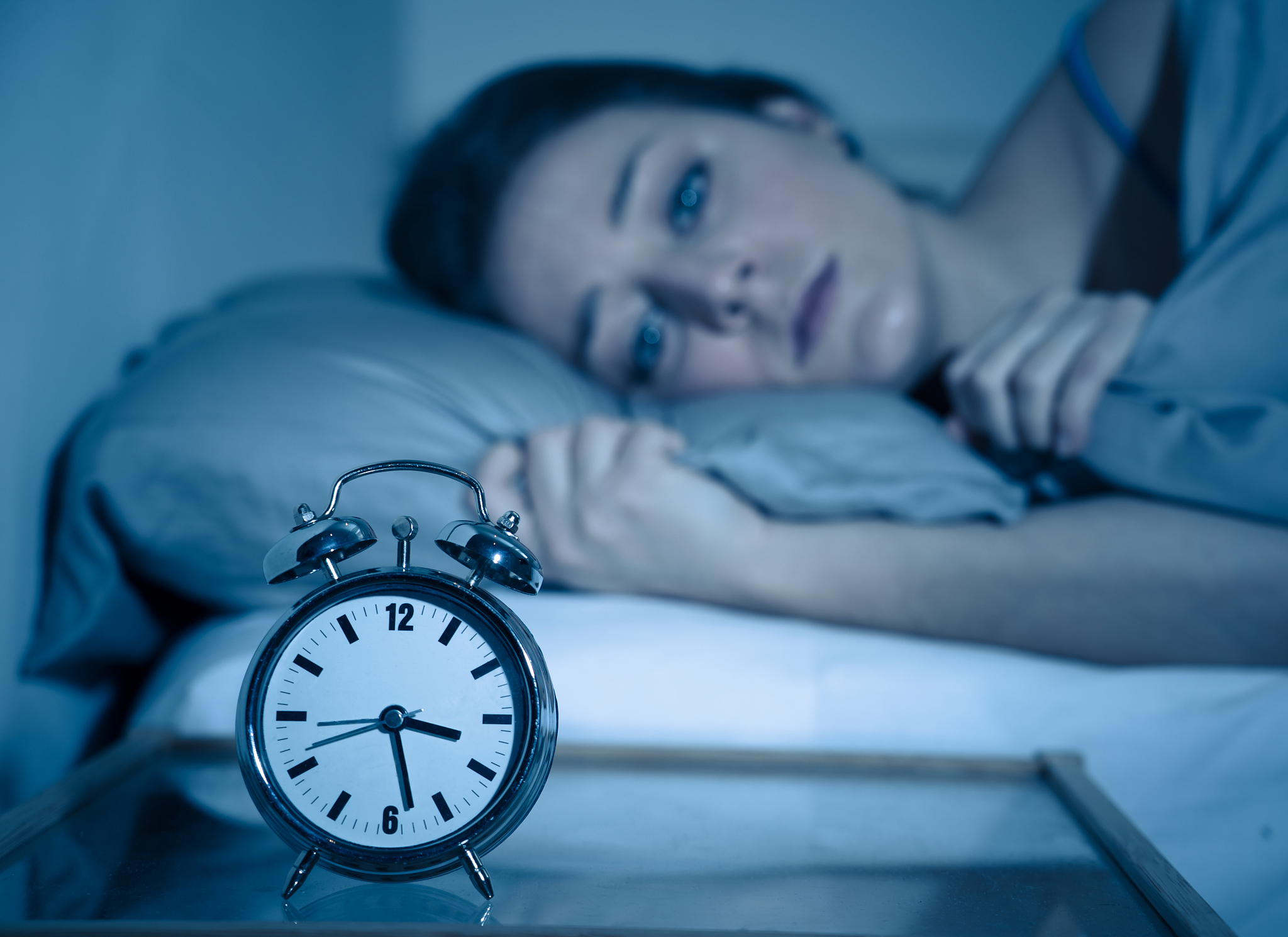 sleepless and desperate beautiful caucasian woman awake at night