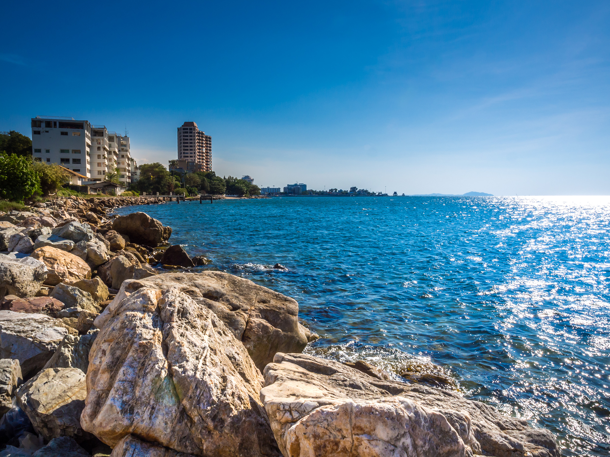 beautiful blue sky, sea and rocks at bang saen thailand.