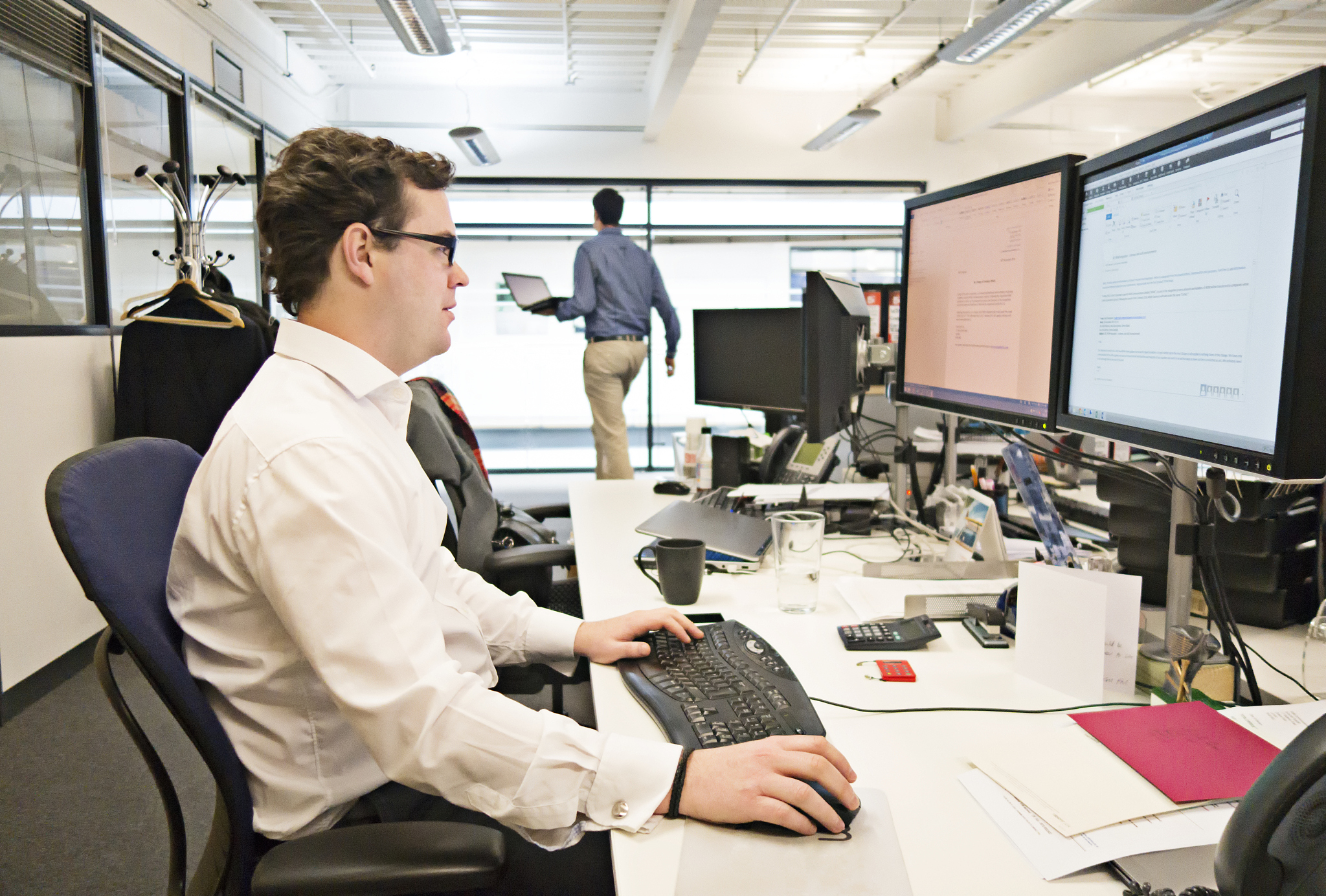 man working at desk in office