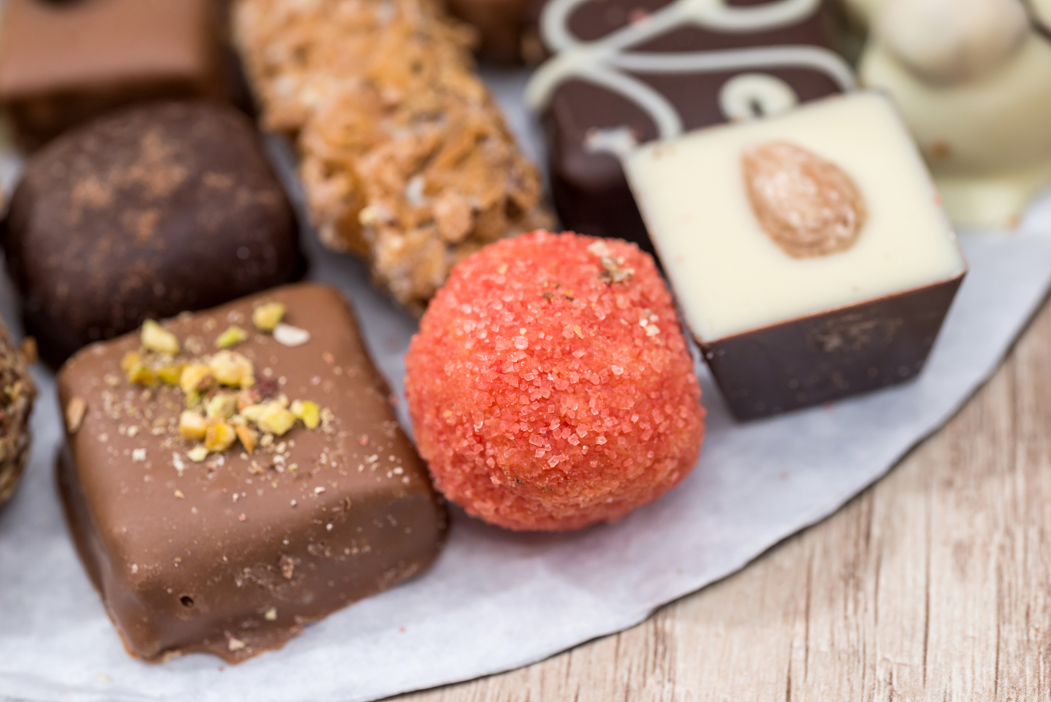 top view on different of delicious chocolate candies, white, dar