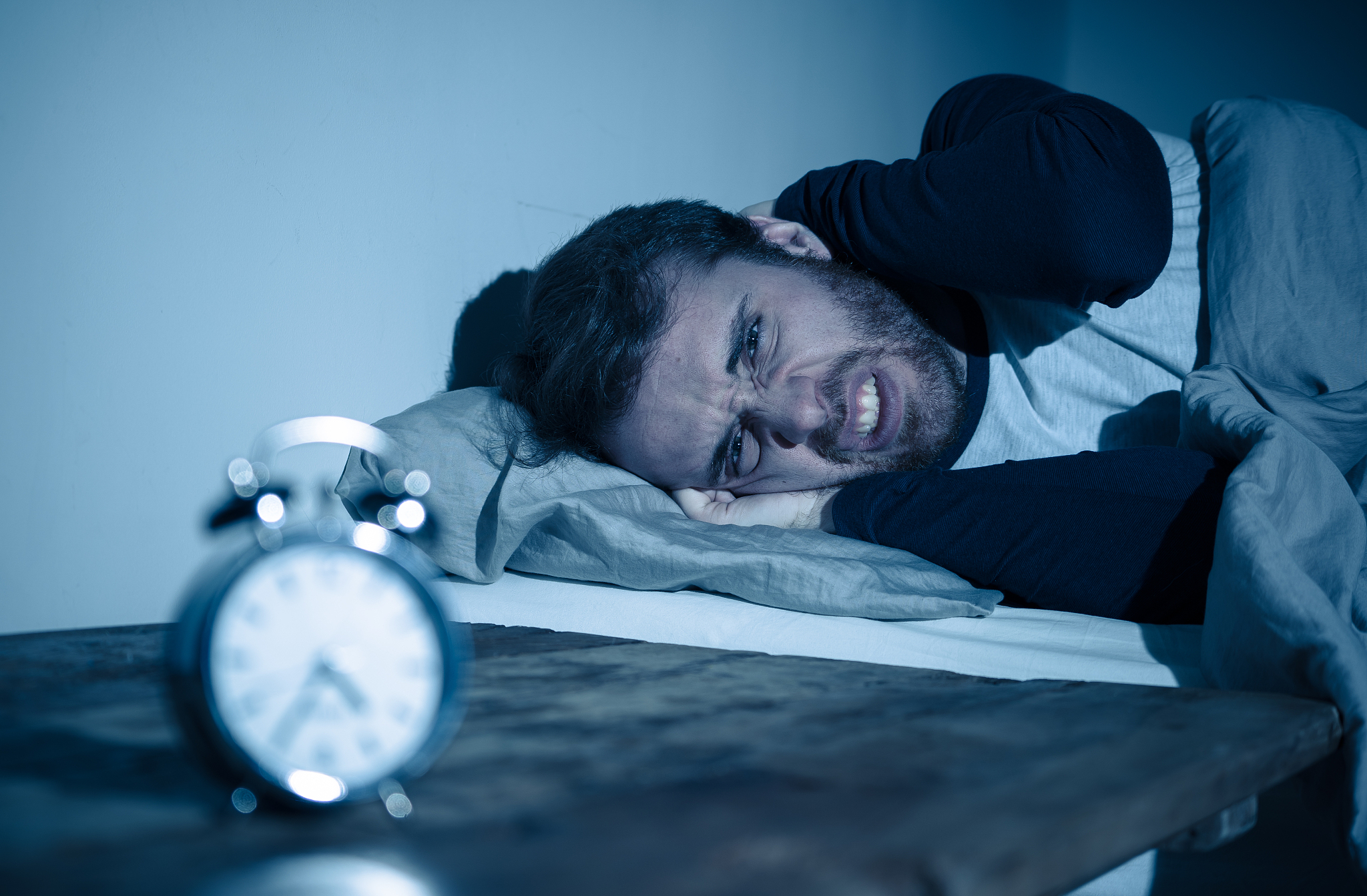 sleepless and desperate young caucasian man awake at night not a