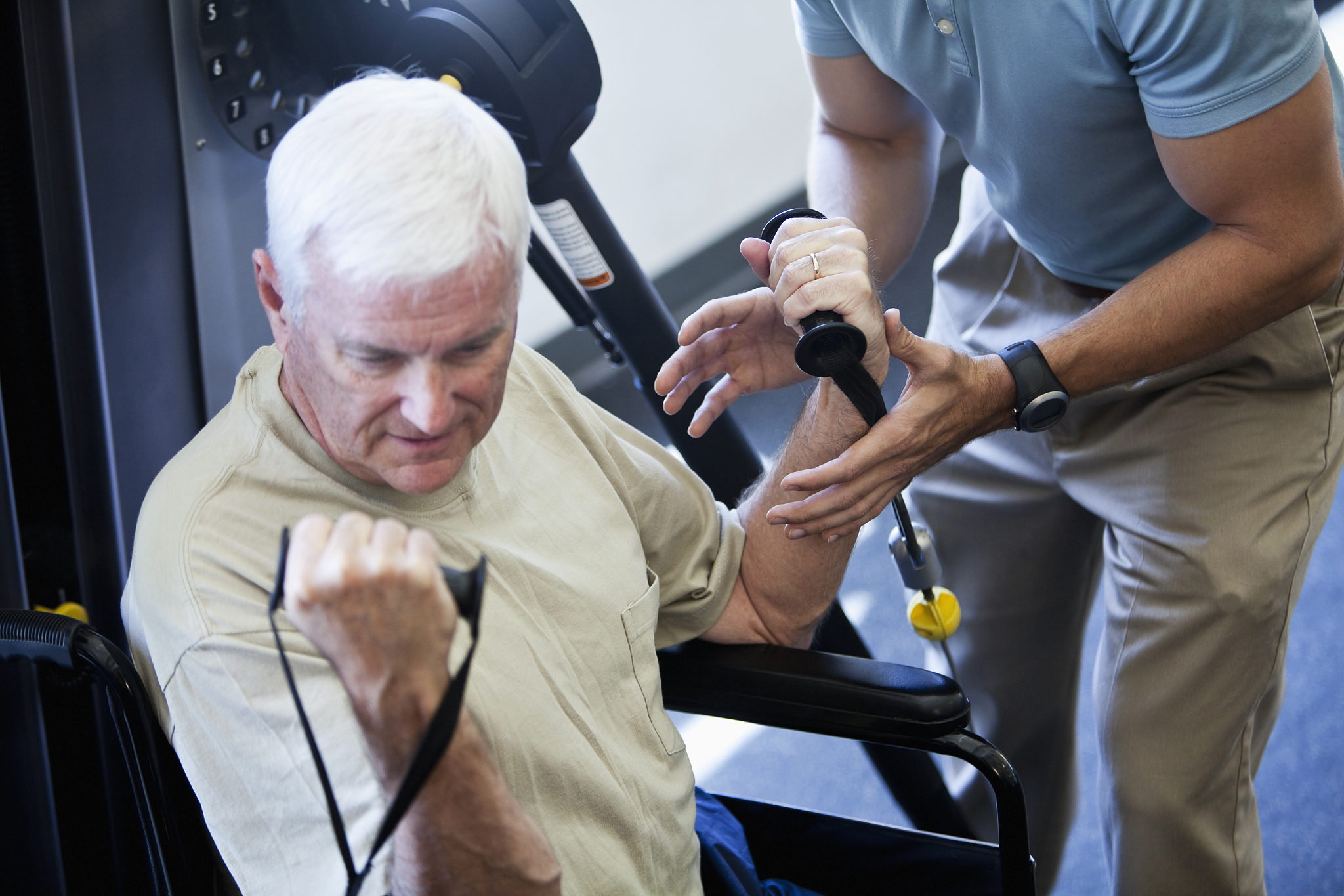physical therapist helping patient