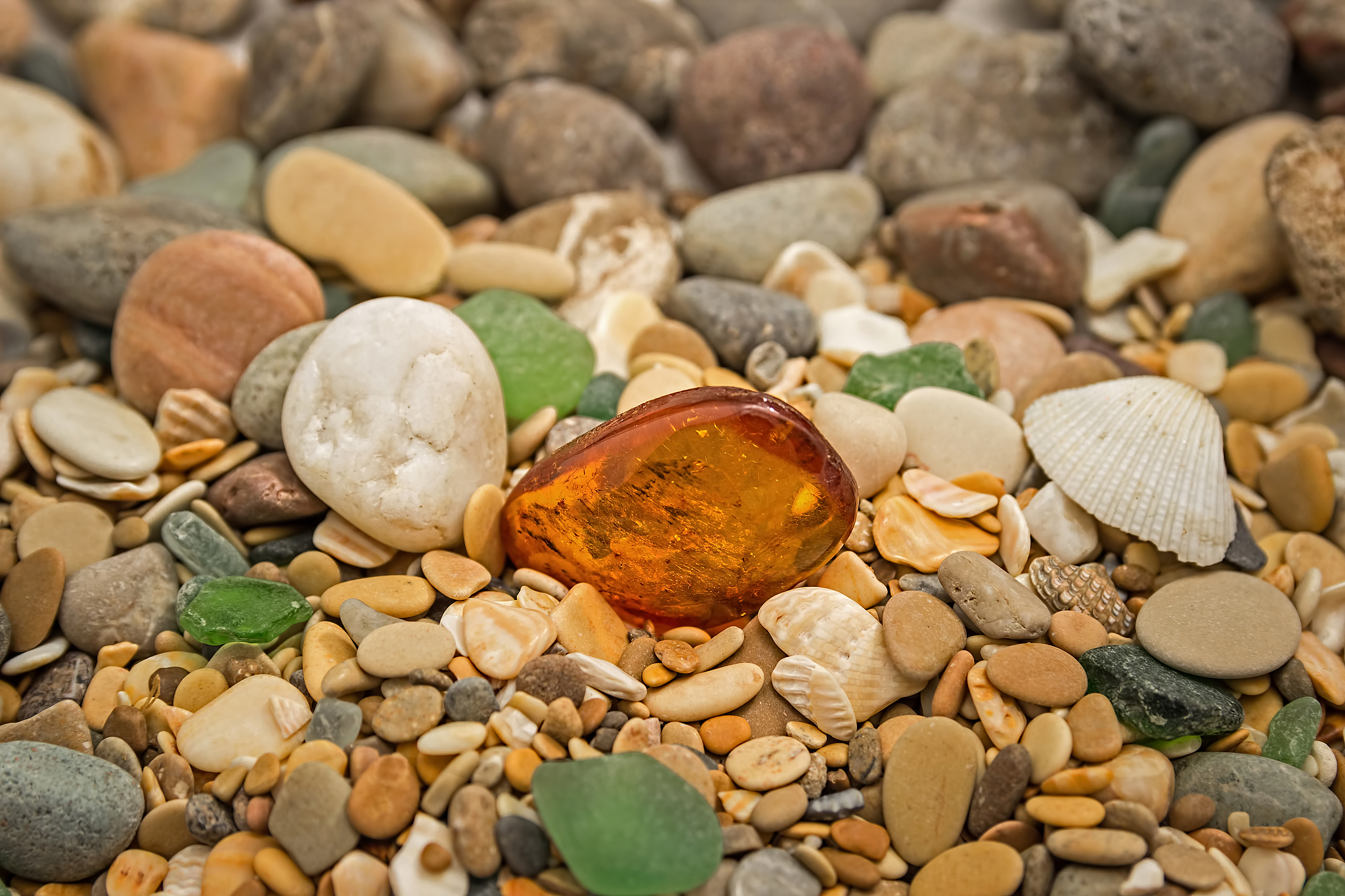 amber stone. mineral amber. rosin yellow amber. sunstone on a be
