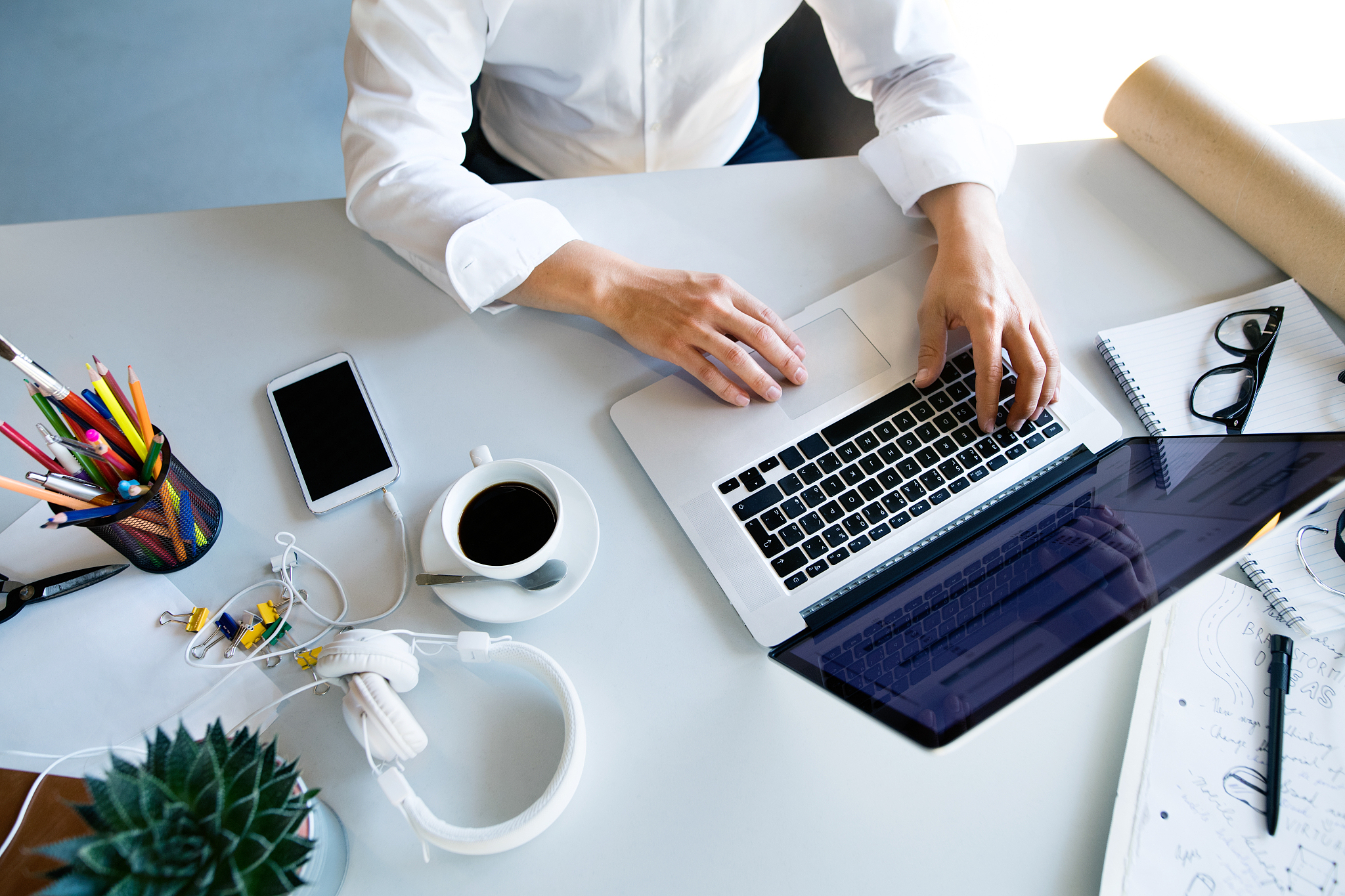 businesswoman at the desk with laptop in her office.