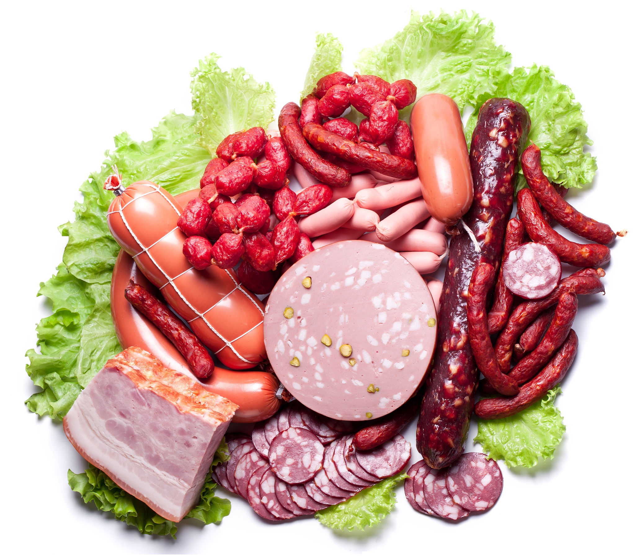 meat and sausages on lettuce leaves.