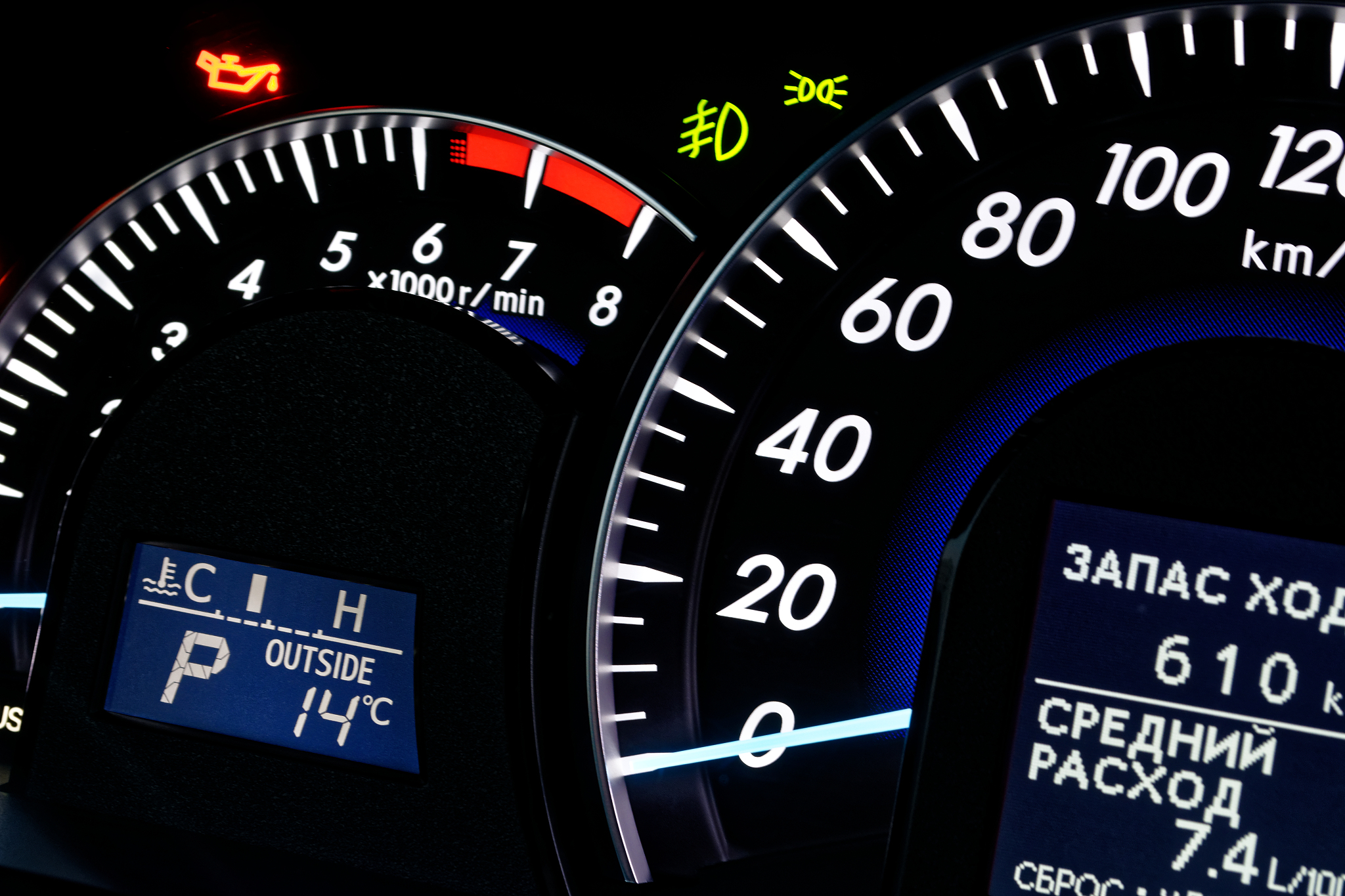 speedometer and tachometer on the dashboard of a car