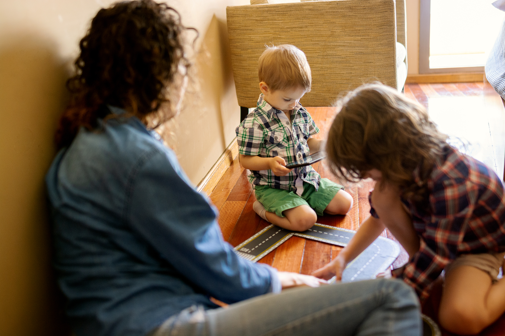 mother and son in the bedroom playing together