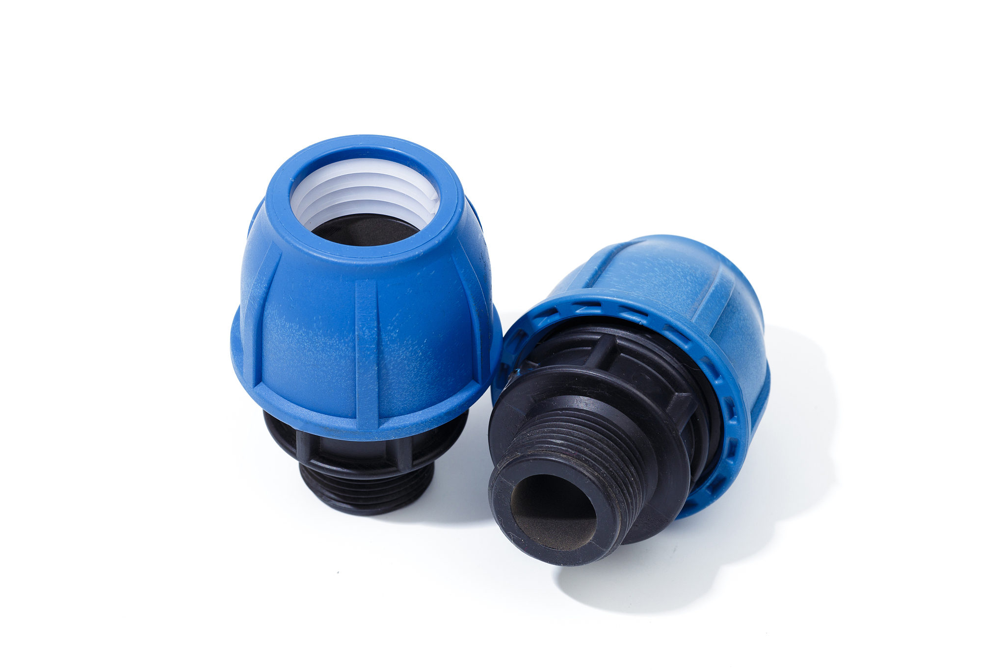 various plastic fittings for polypropylene pipes on a white back