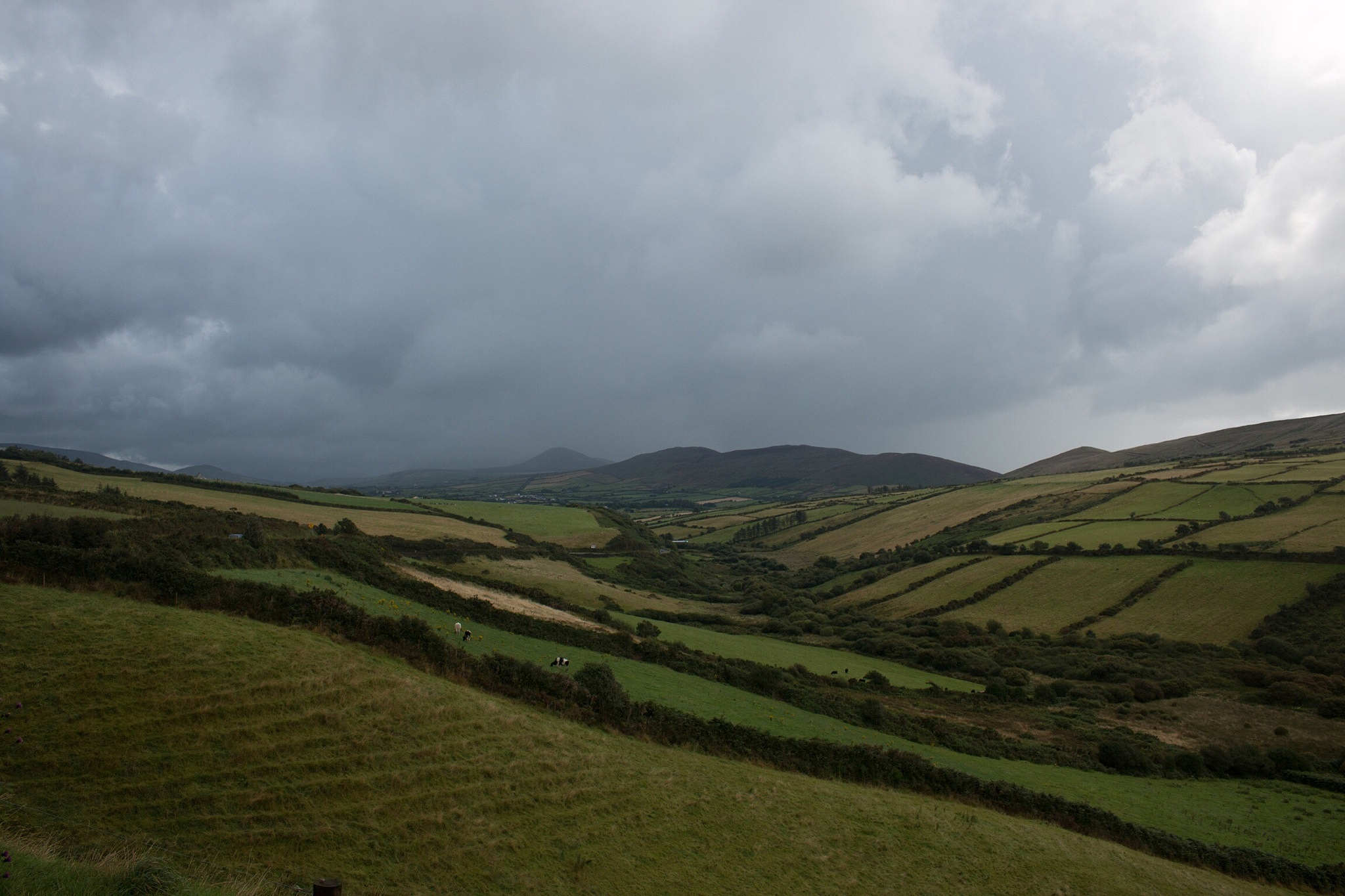 view of landscape below cloudy sky