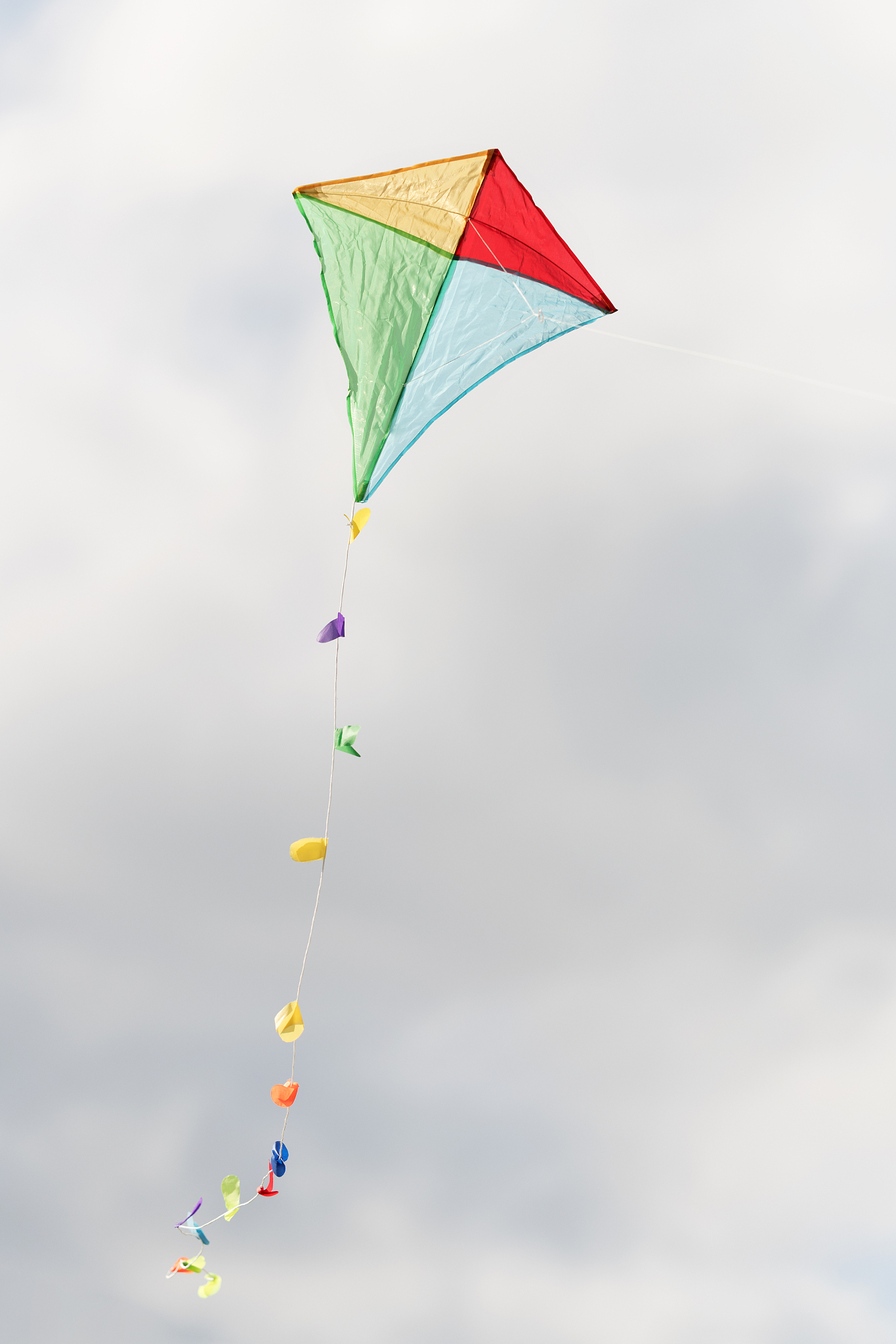 colorful kite in a cloudy sky