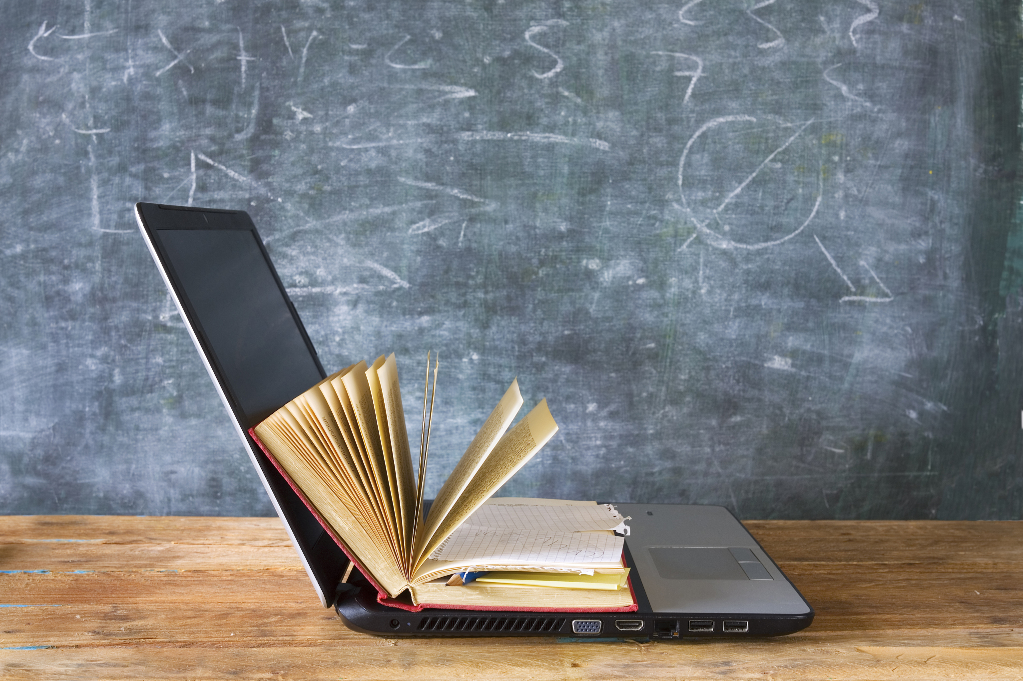 open book and laptop computer