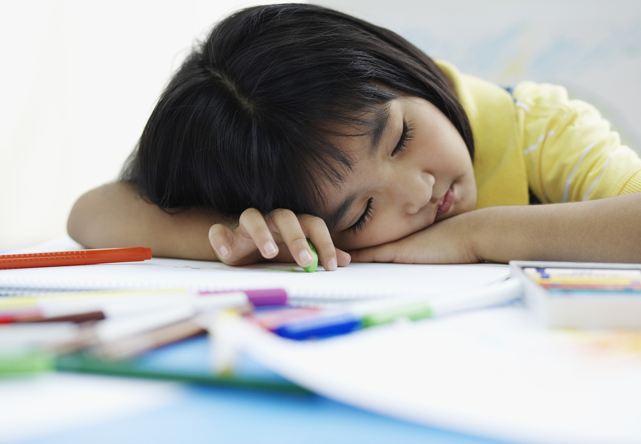 girl asleep on a desk