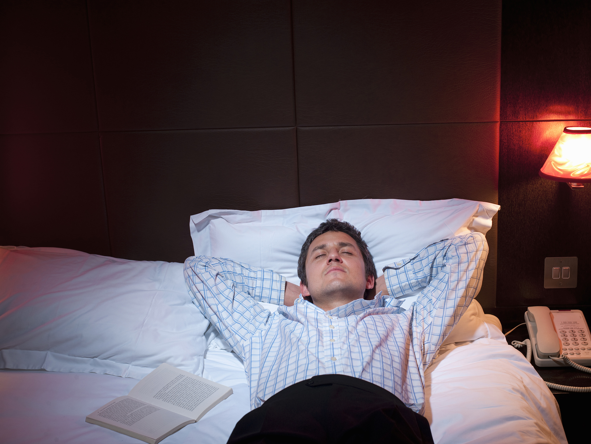 businessman sleeping in hotel room