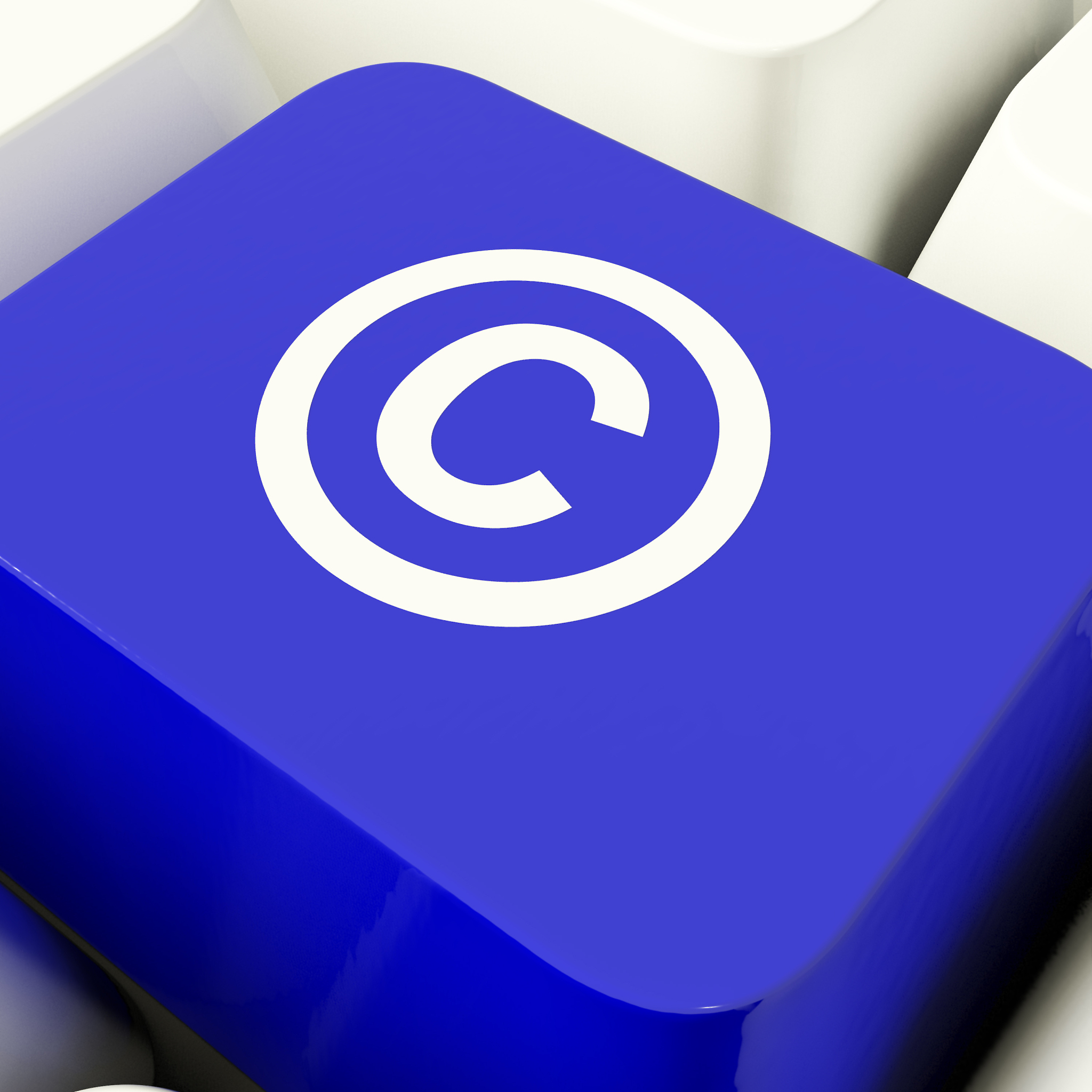 copyright computer key in blue showing patent or trademark