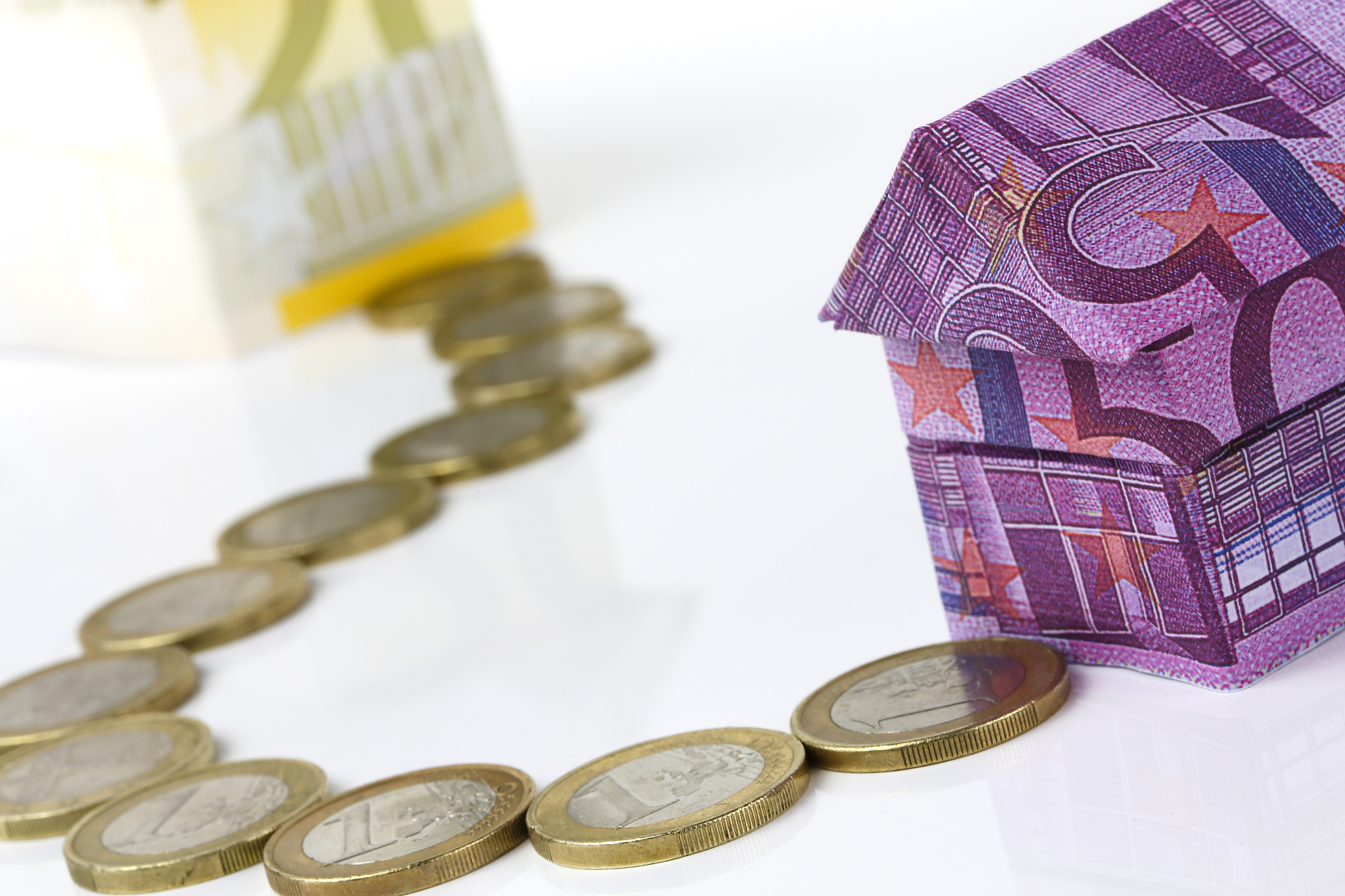 euro bank notes house and coins