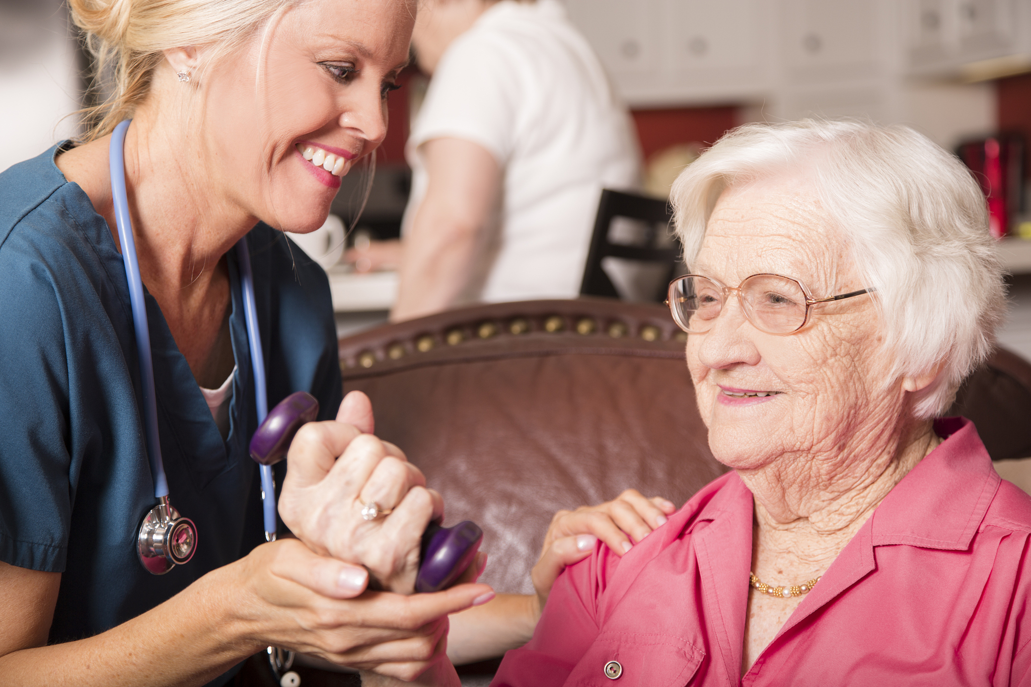 senior adult patient with home healthcare nurse. physical therap