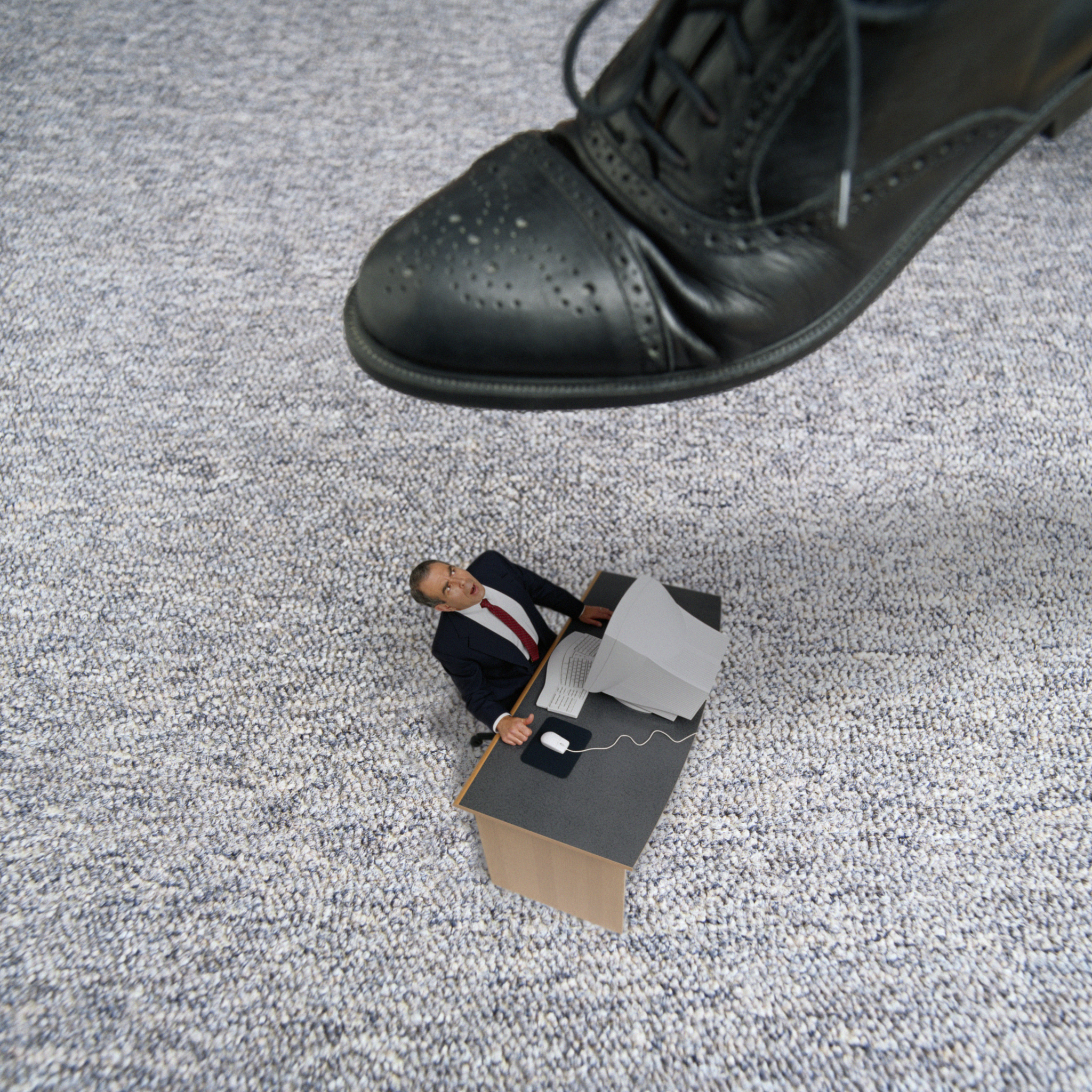businessman getting stepped on