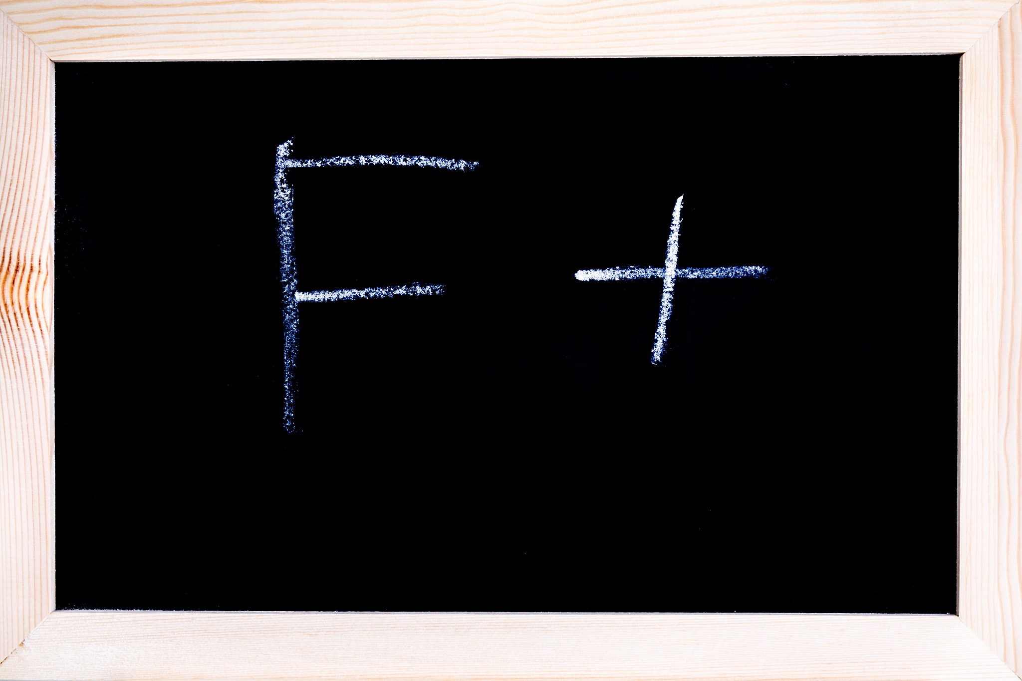 white chalk written on a blackboard