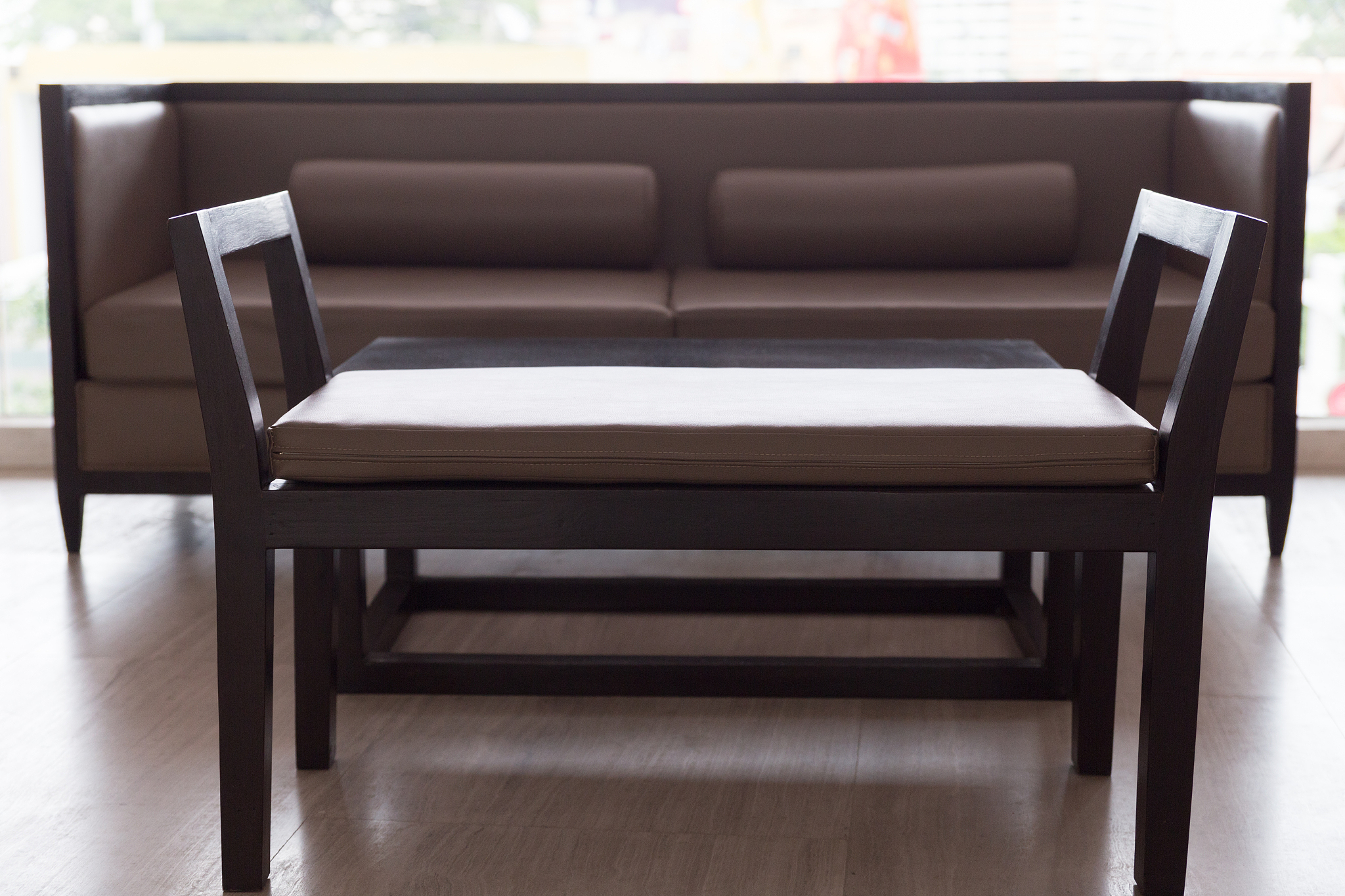 wooden sofa with brown leather cushion