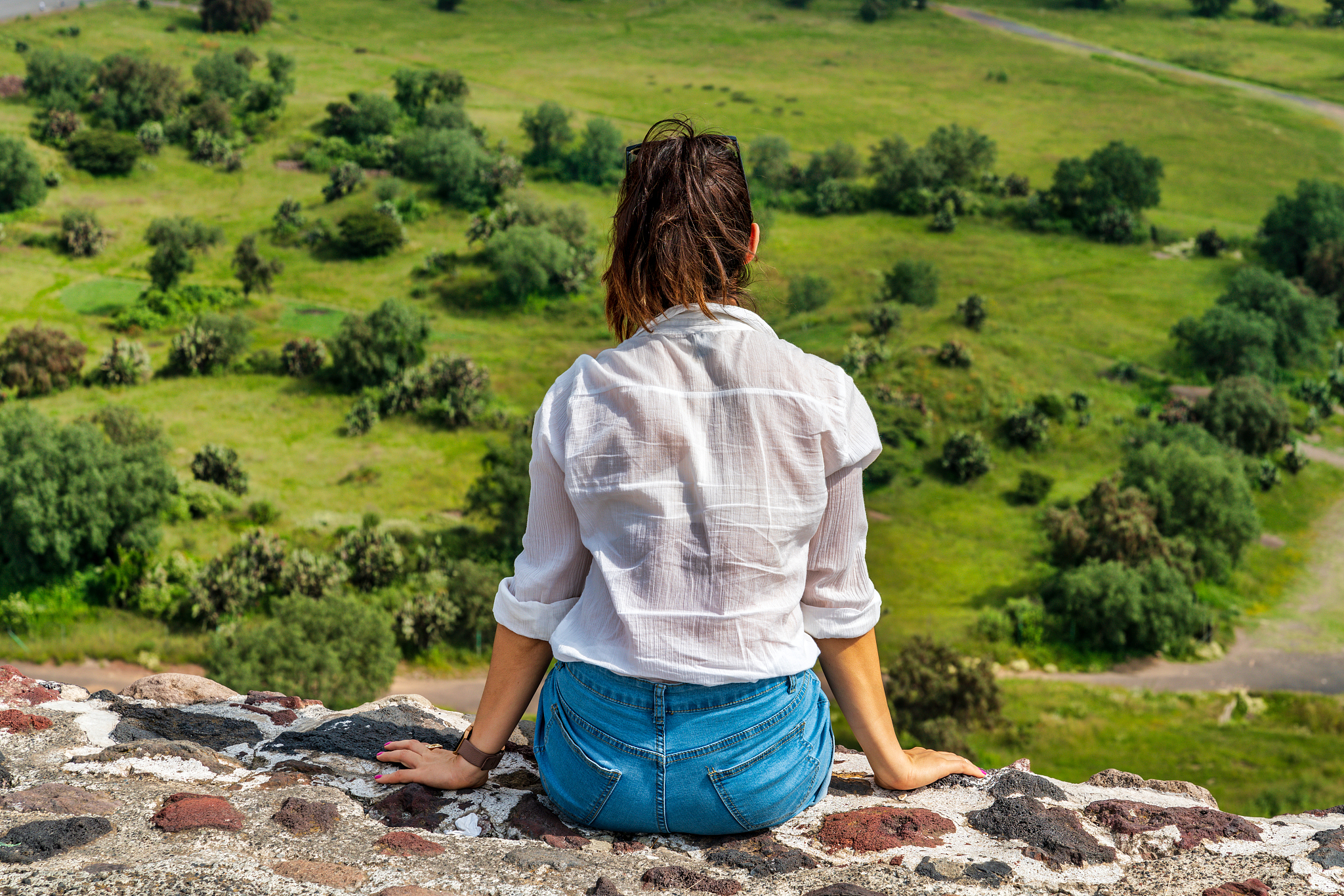 tourism in mexico - young adult tourist at ancient pyramids