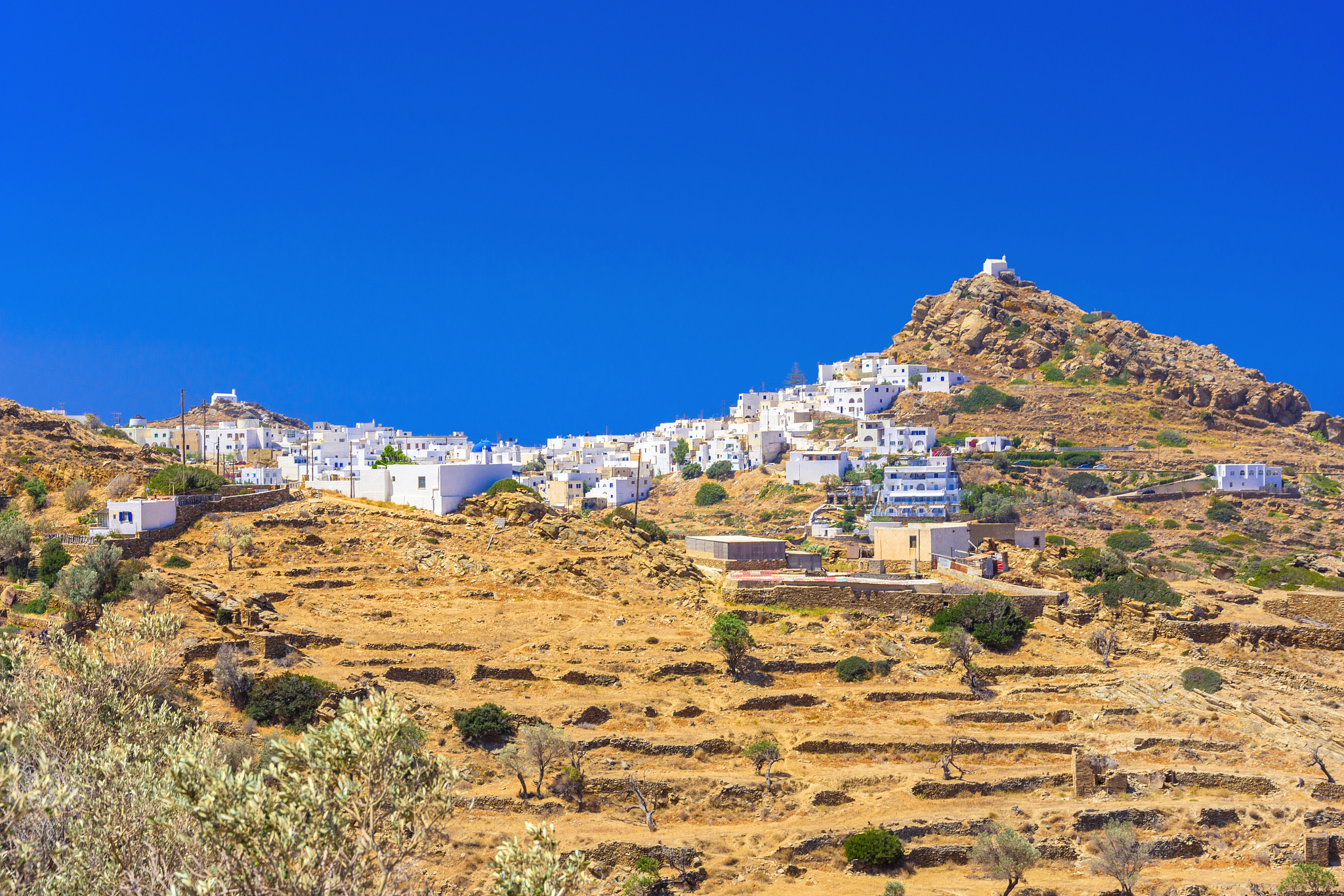 traditional houses, wind mills and churches in ios island, cycla