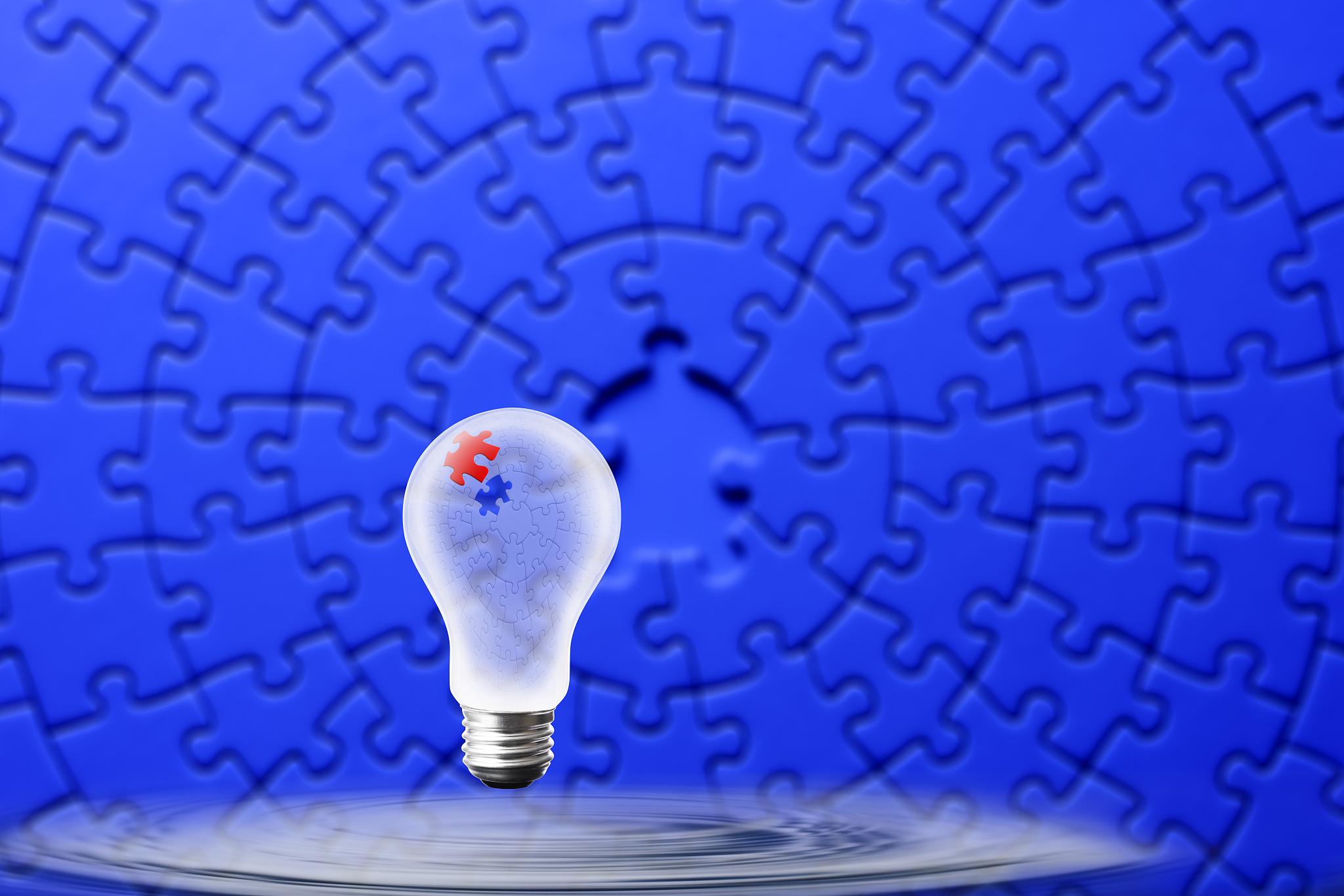 light bulb floating in mid-air of the water surface