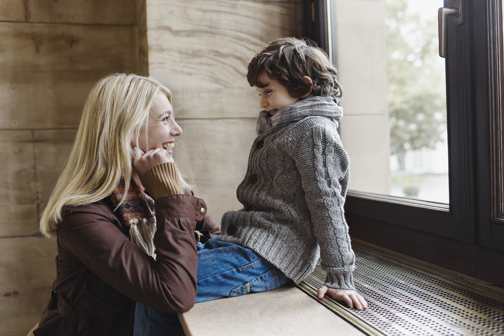 happy mother and son at the window