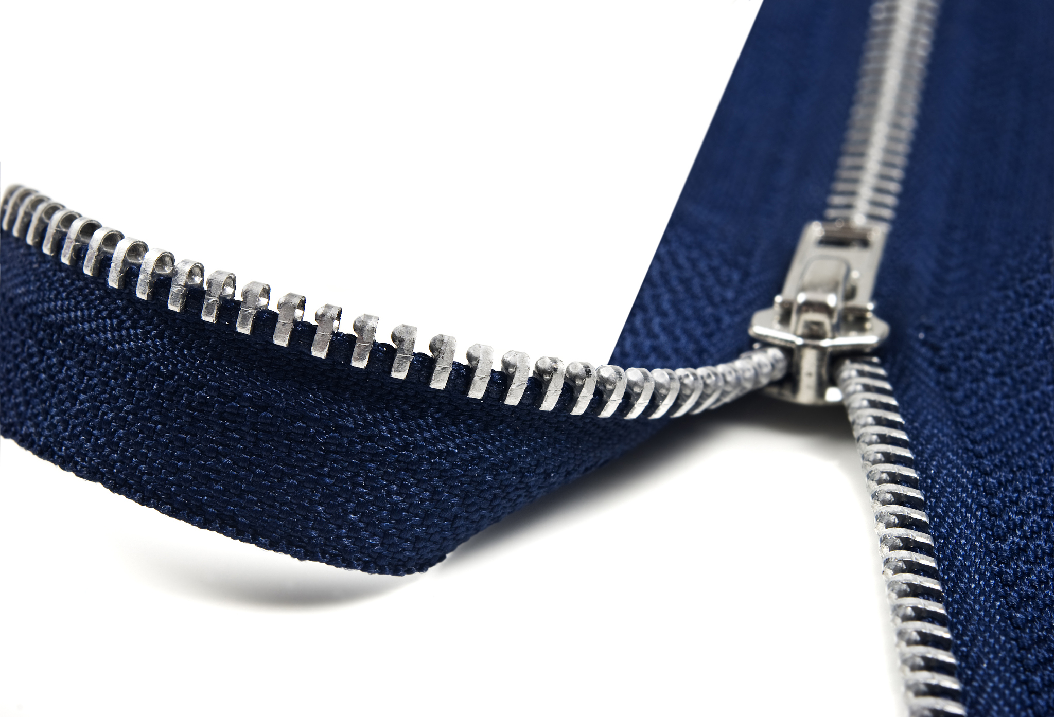 dark blue zipper opening up to a white background