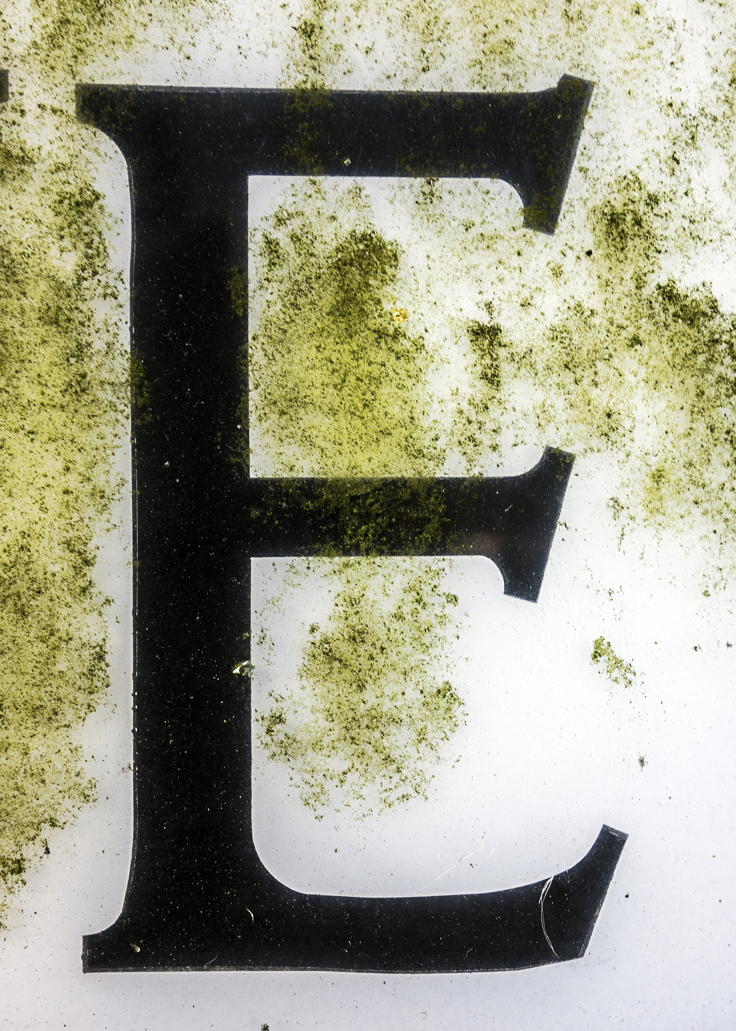 written wording in distressed state typography found letter e