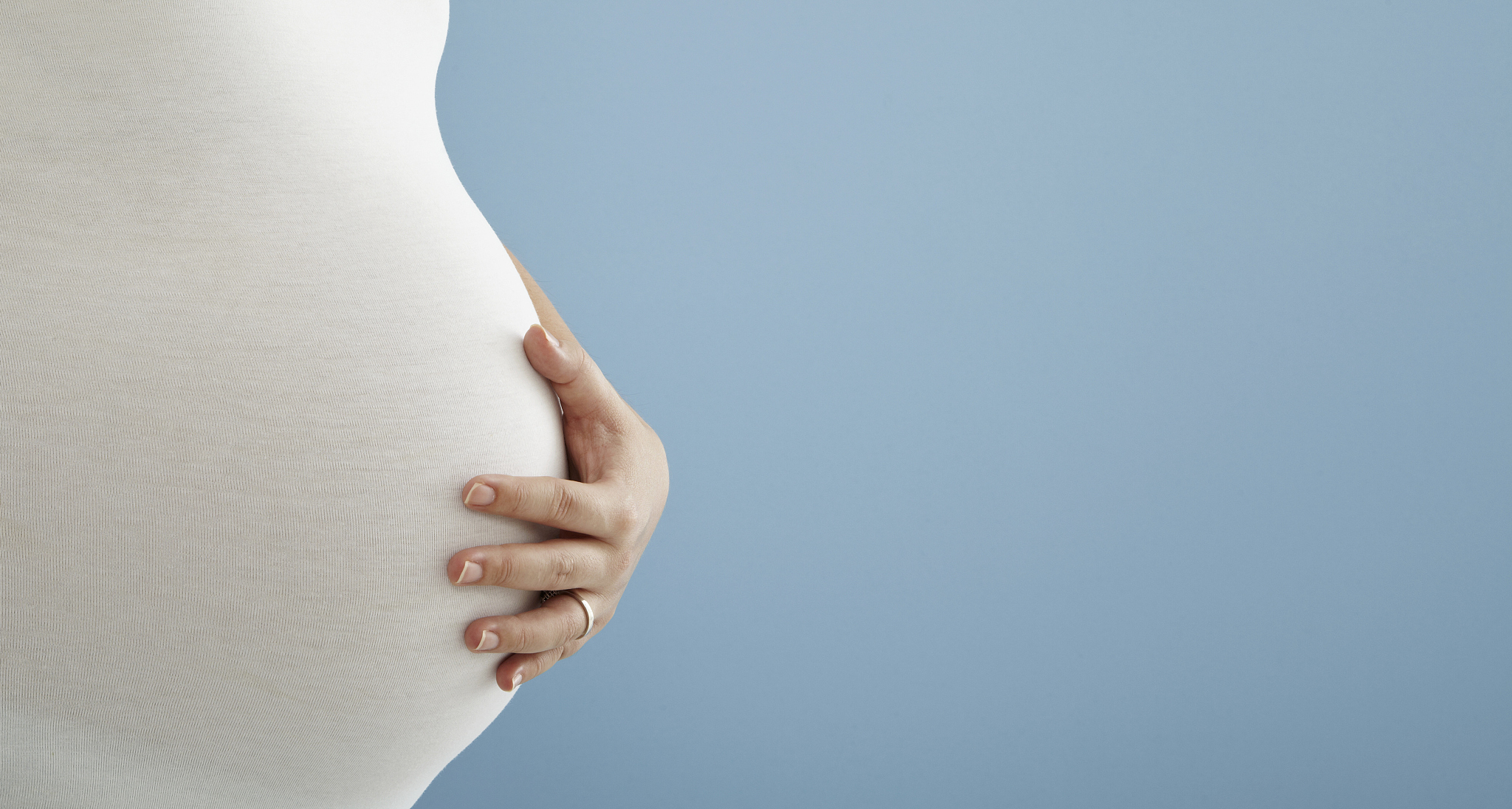pregnant woman with hands on belly