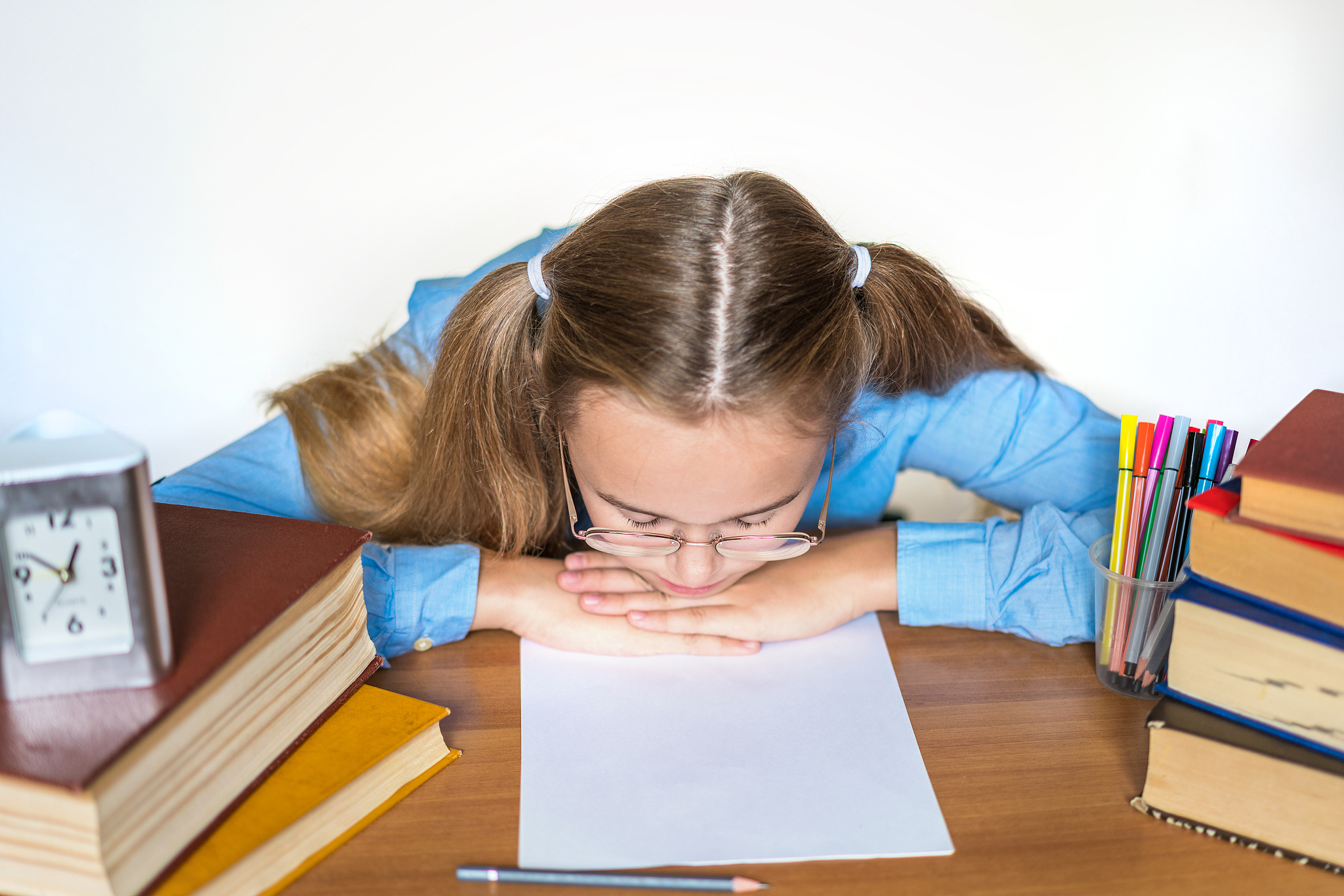 overwhelmed high school teen girl exhausted with difficult studi
