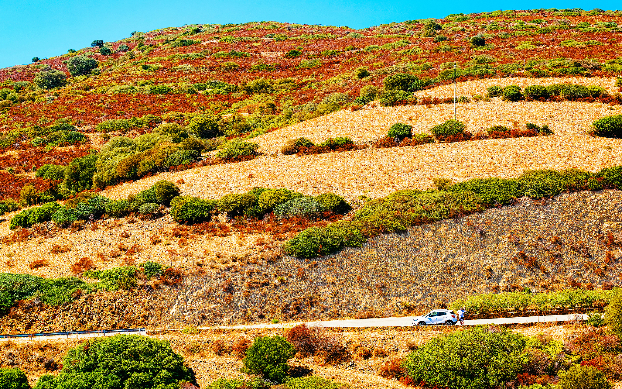 car on beautiful road in teulada cagliari sardinia reflex