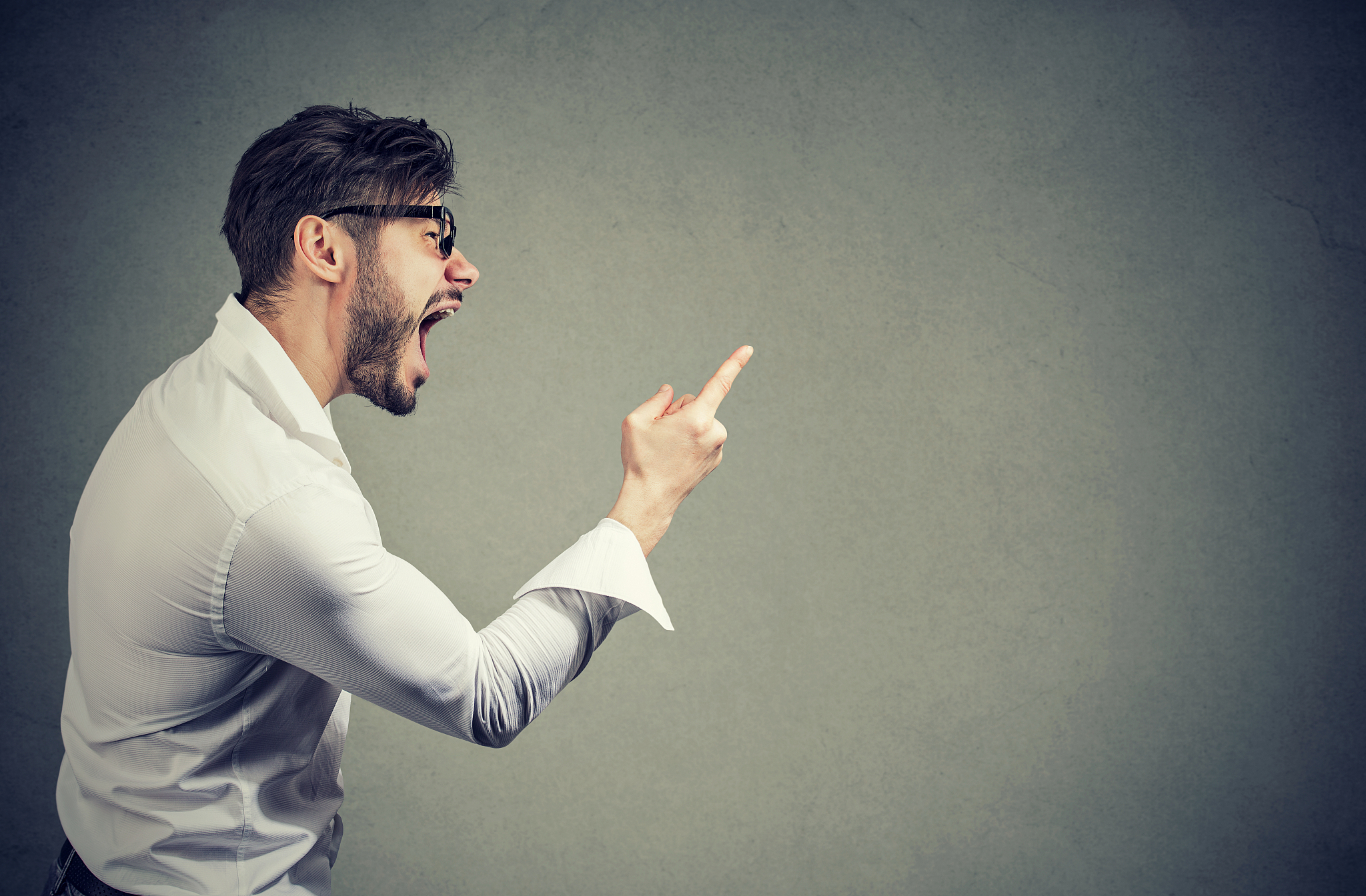 screaming angry man on gray