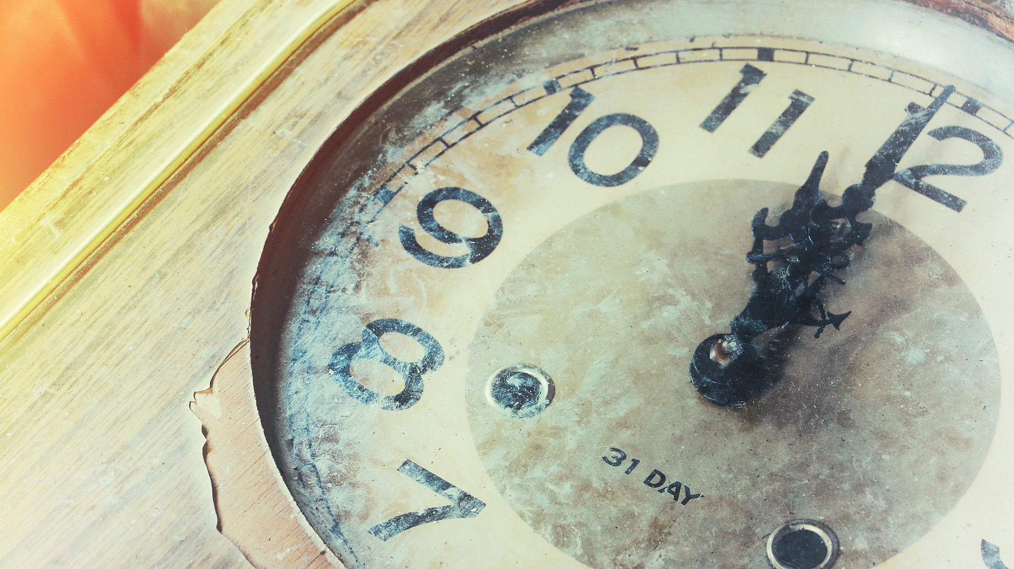 close up of an old vintage clock face with clock hands, number o