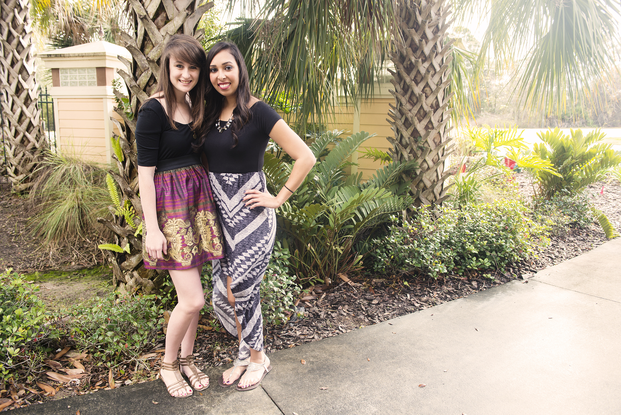 two friends pose together