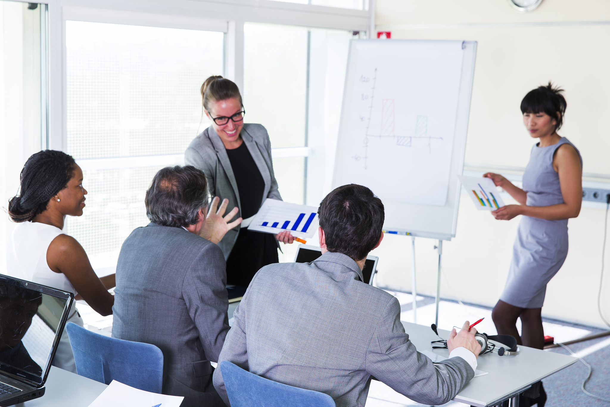 business people in education room talking with cute lecturers
