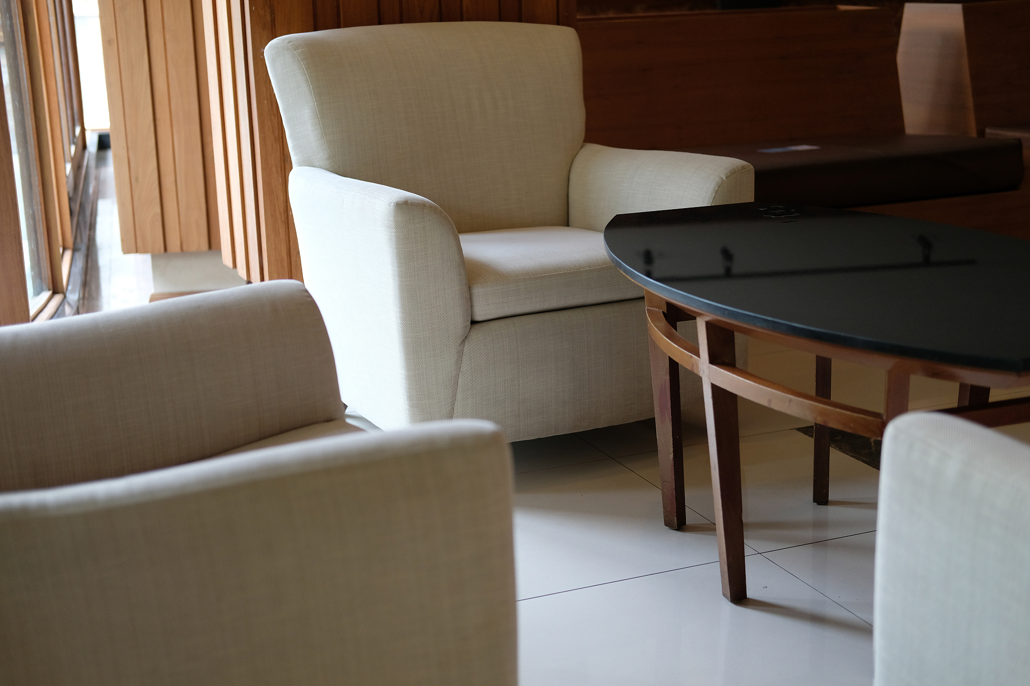 beige cushion sofa chair armchair in living room. home interior