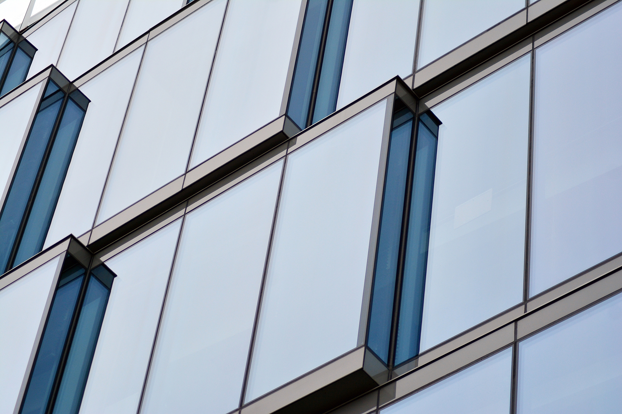 view of modern glass skyscraper,exterior of glass wall with abst