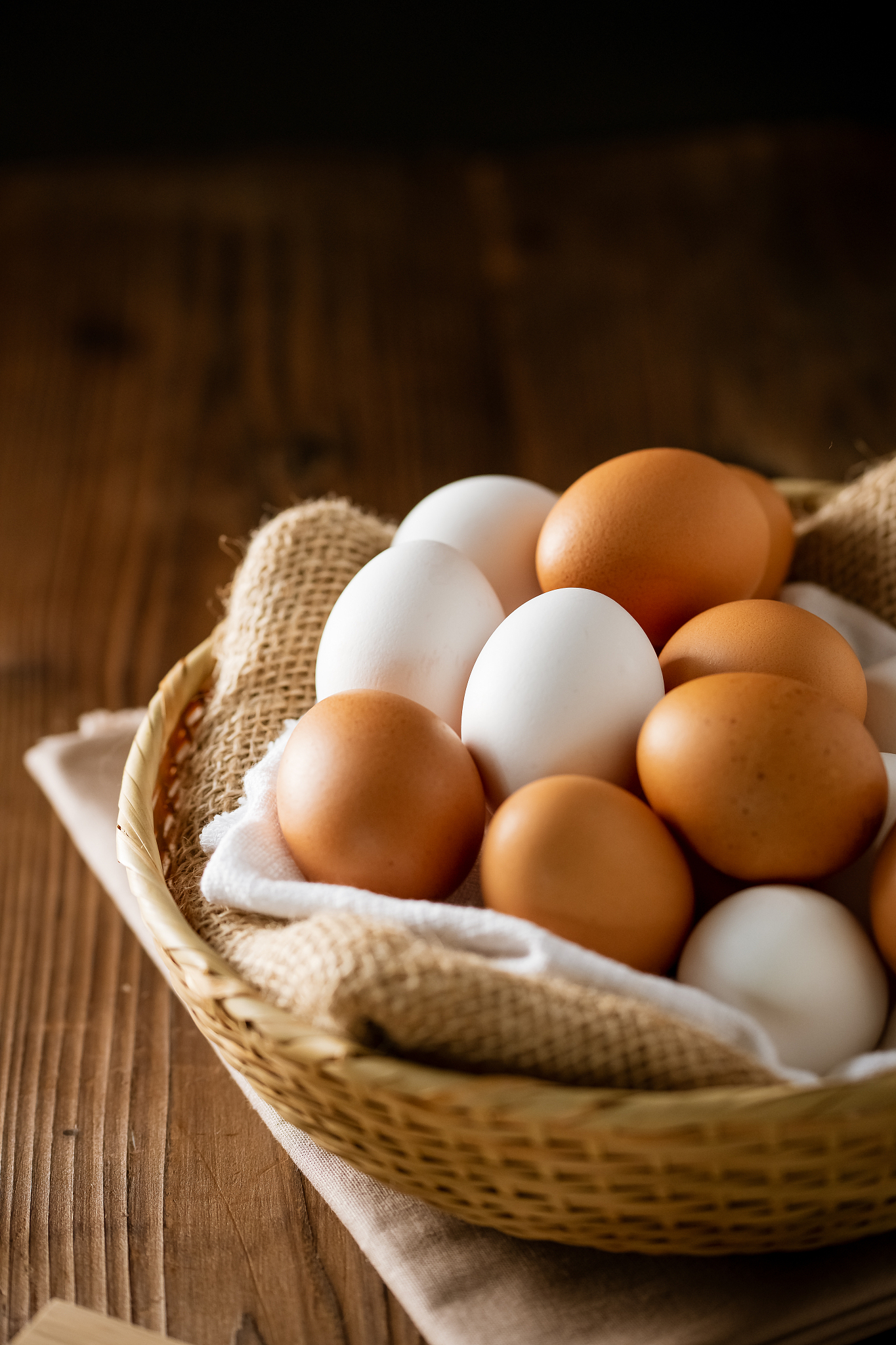 chicken eggs in basket on table. fresh chicken eggs.