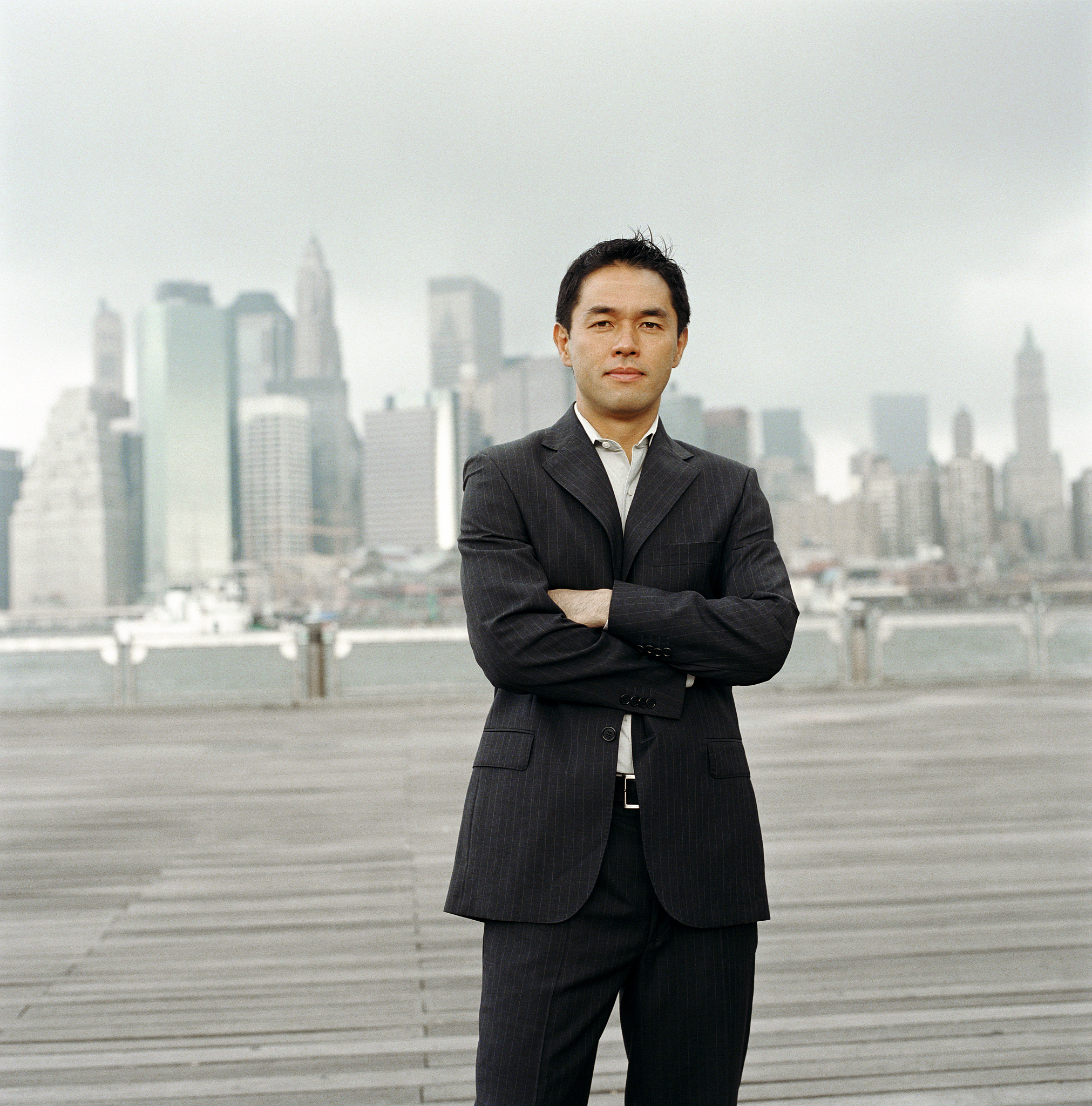 usa, new york city, businessman on riverfront boardwalk, portrai