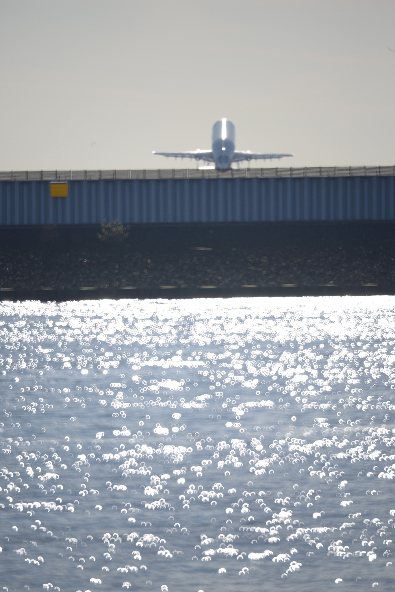 view of airplane over calm sea