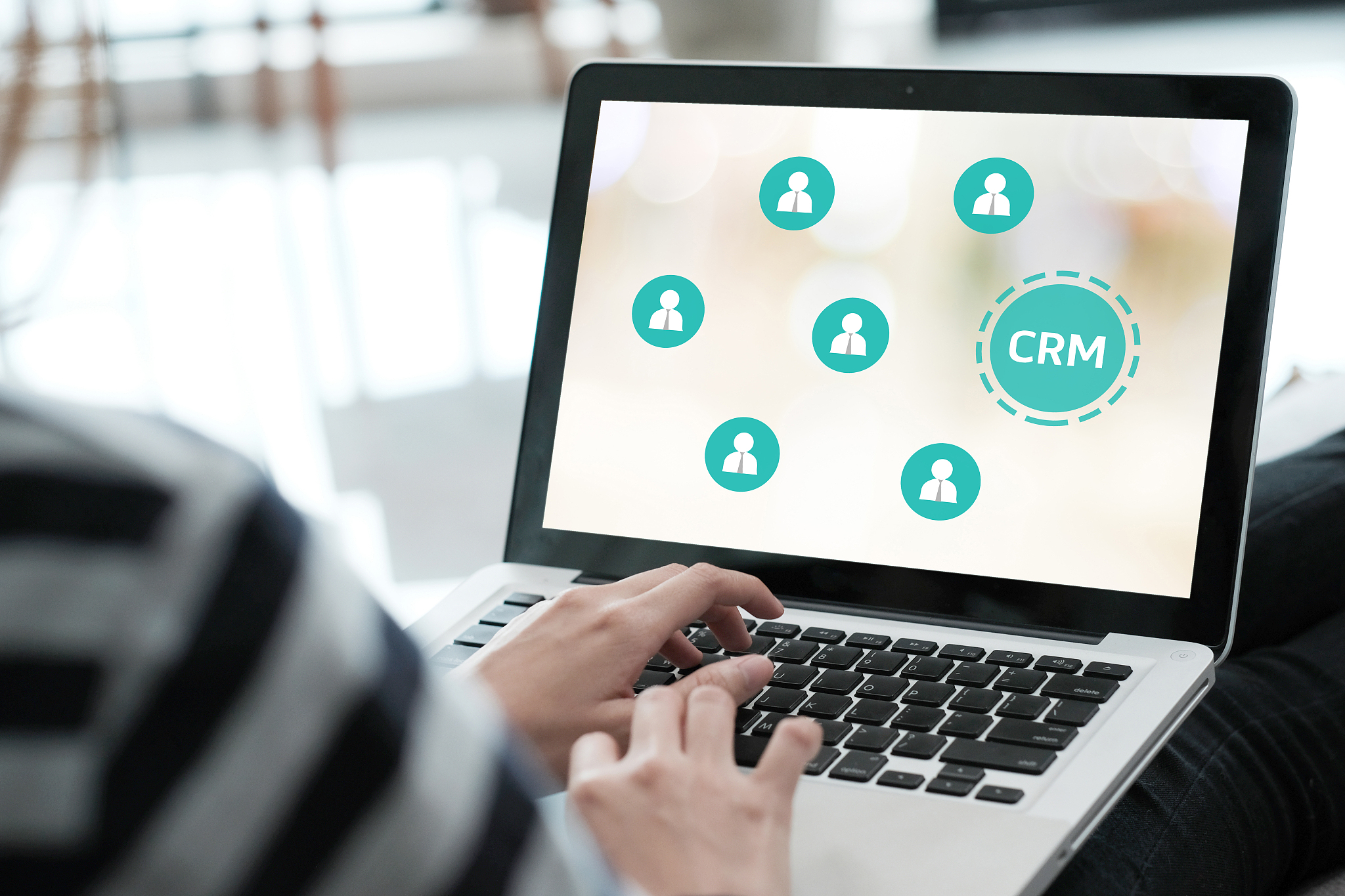 woman using laptop computer with crm, customer relationship mana