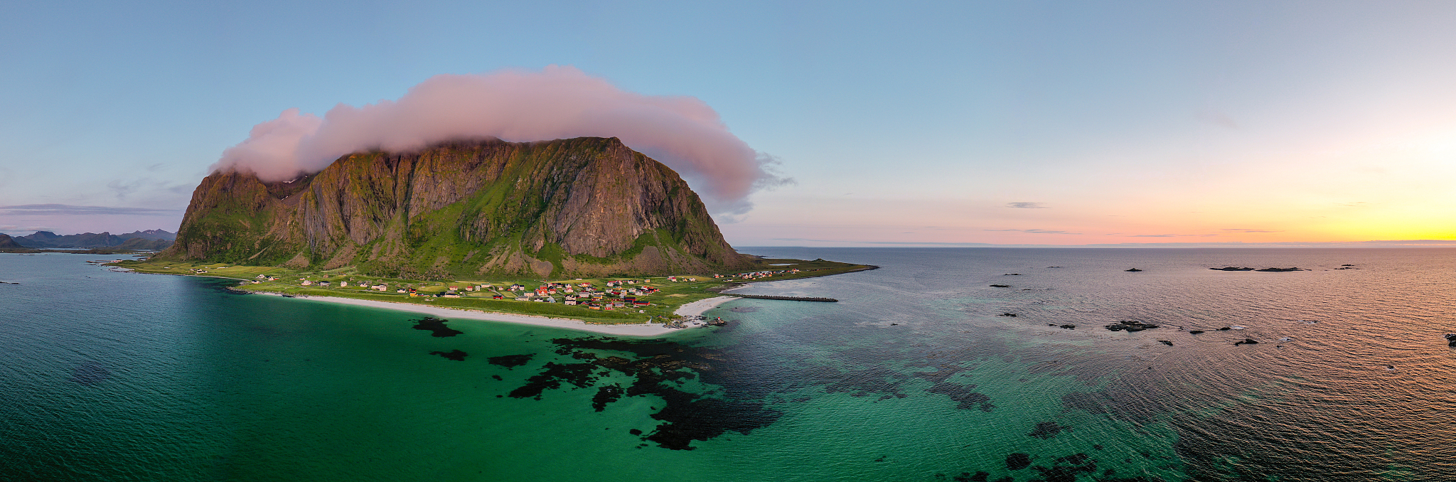 aerial view of a mountain overlooking a village in bstad, norway