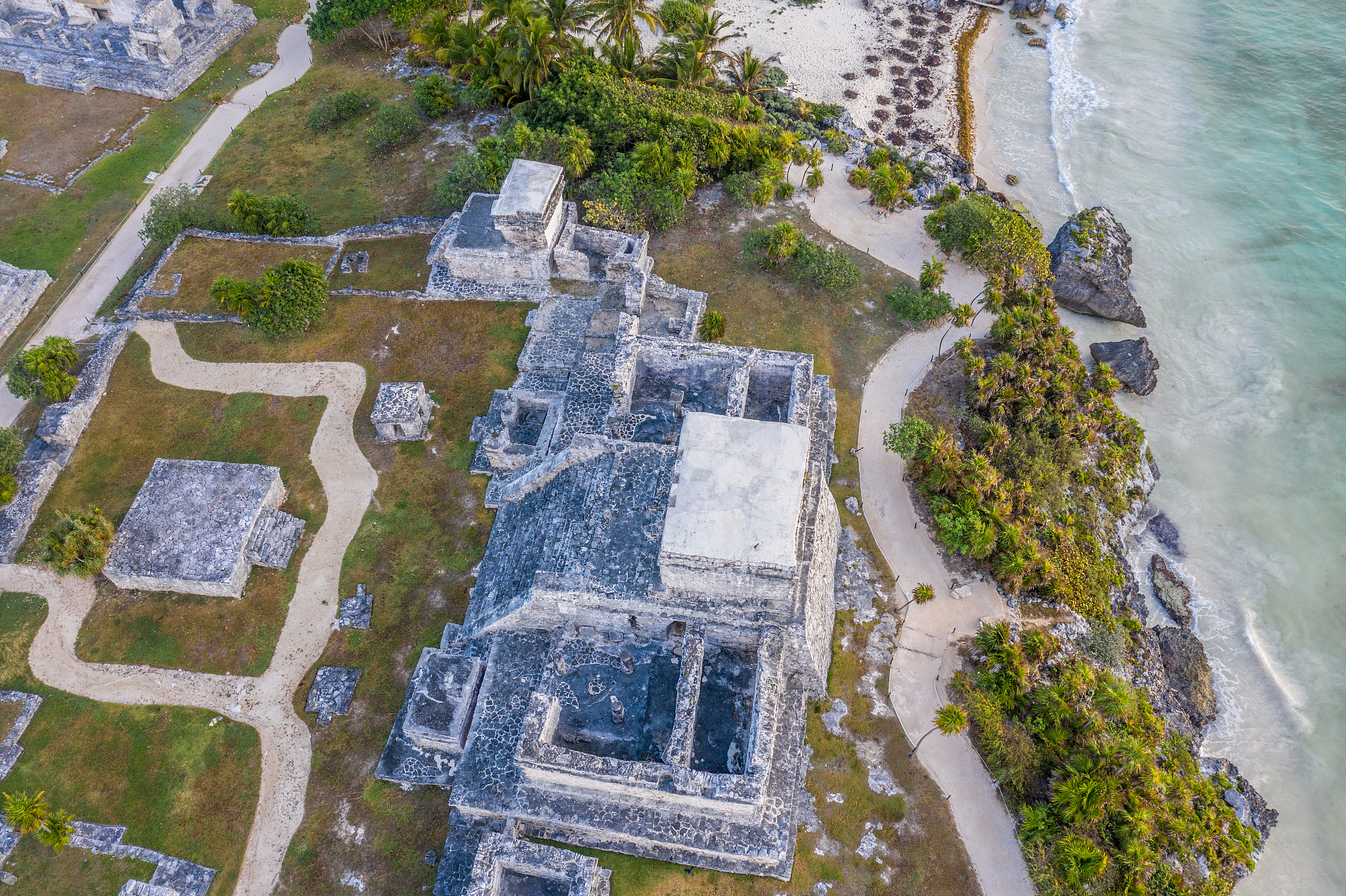 drone view of el castillo, tulum ruins archeological zone, mexic