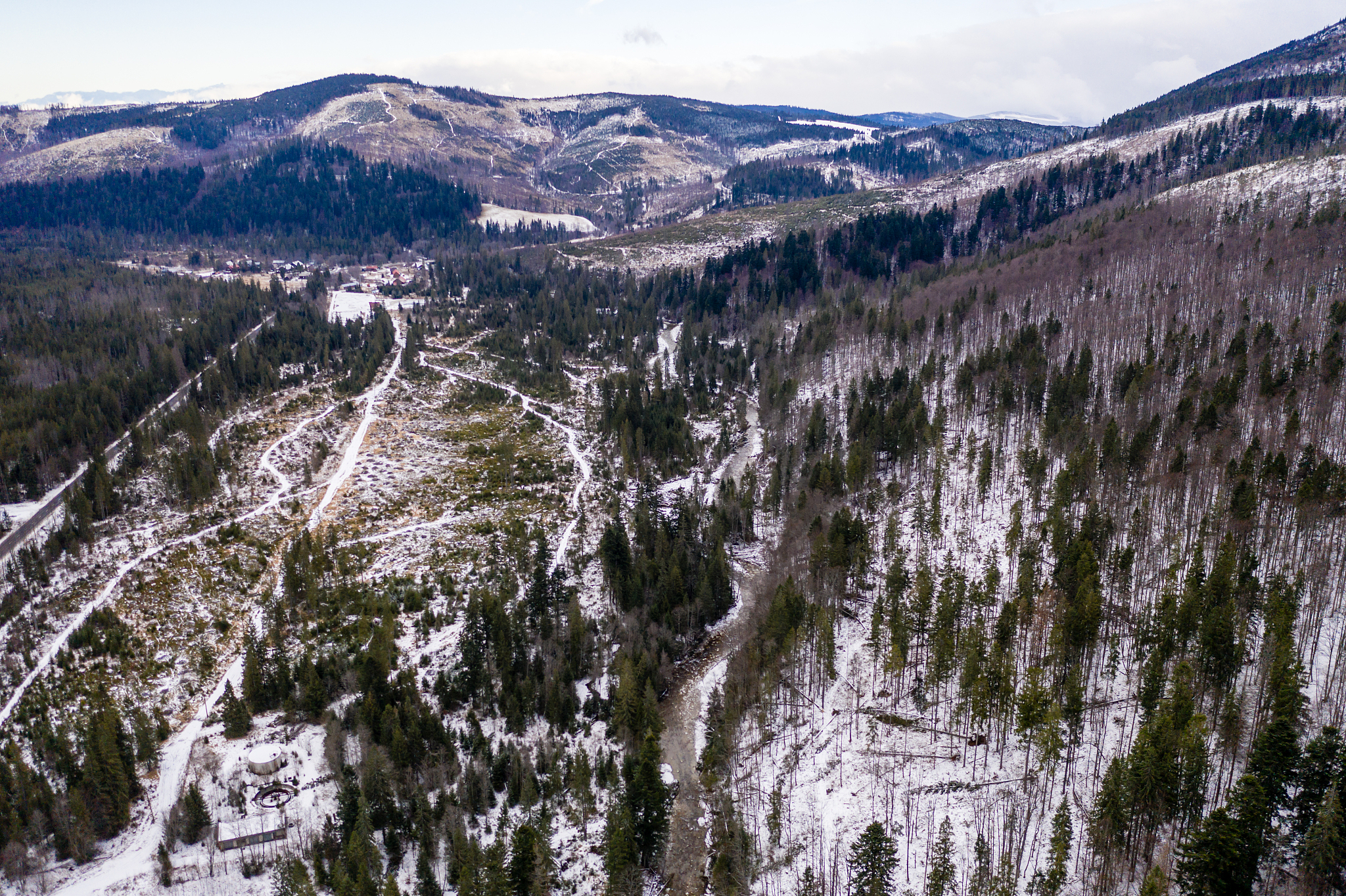 Scenic Mountain Road: A Breathtaking View of a Snow-Capped Peak
