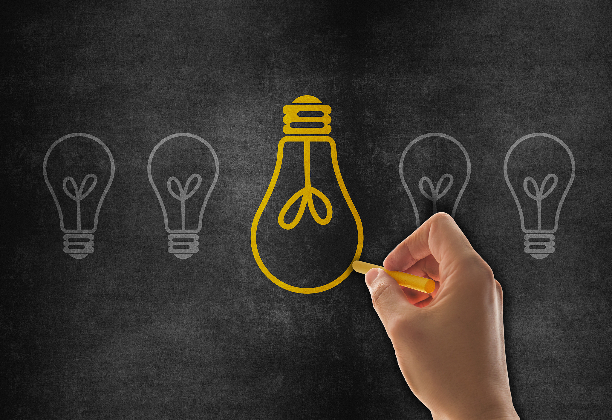 hand drawing big idea light bulb on blackboard